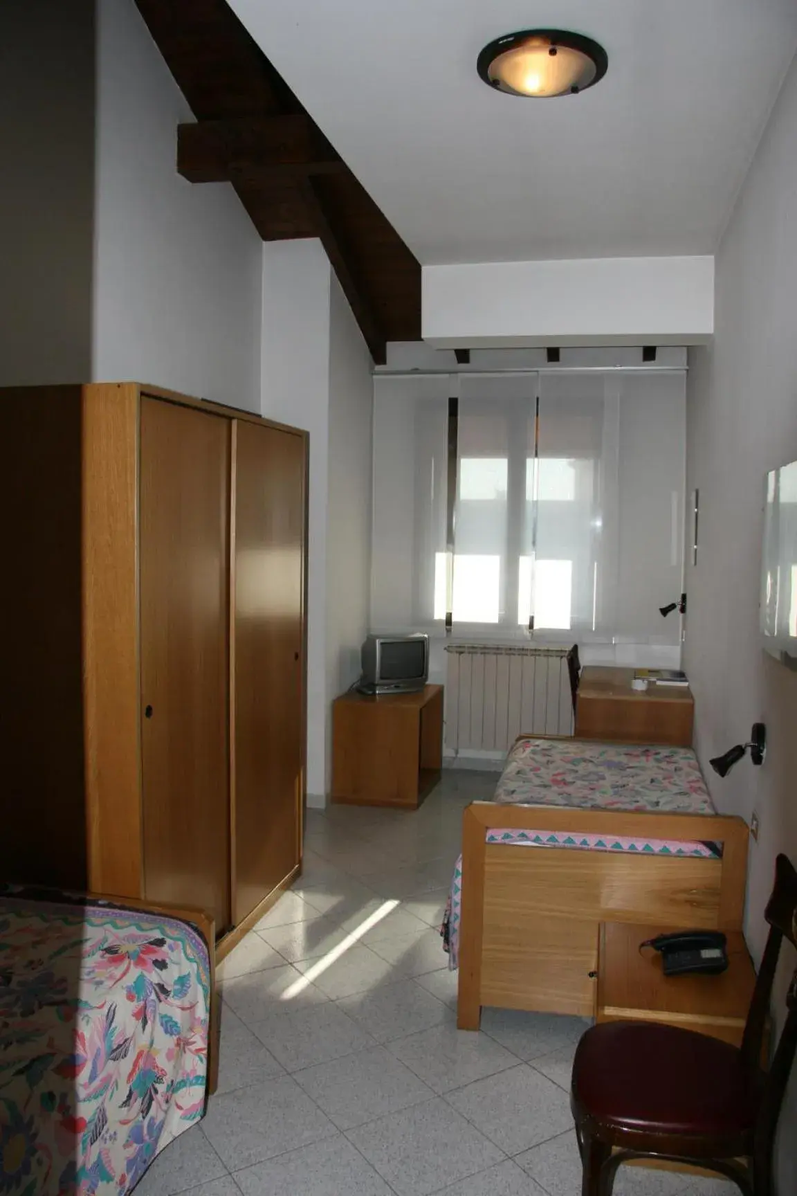 Photo of the whole room, TV/Entertainment Center in Albergo Sant'Anna