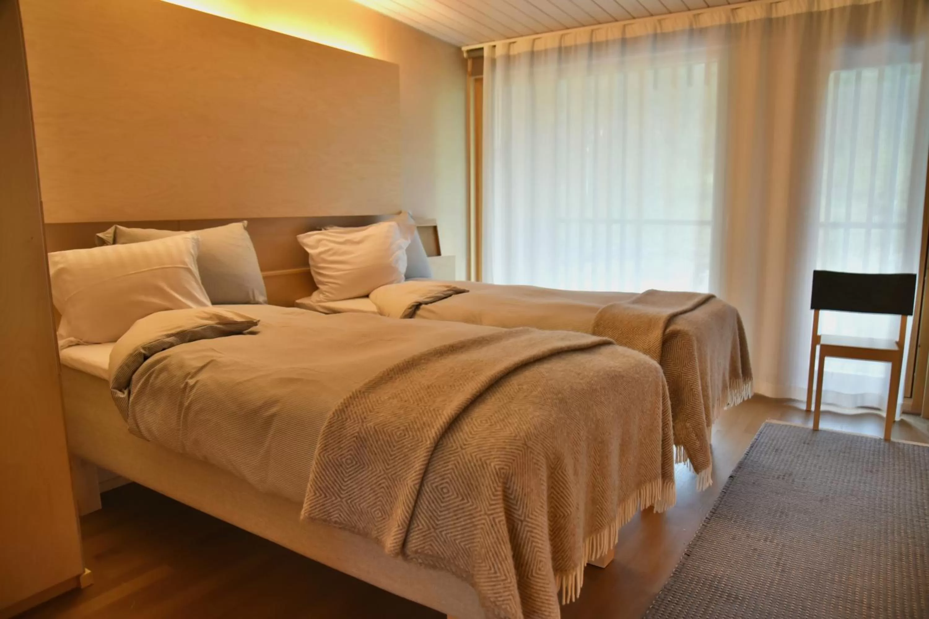 Bed in Saimaanranta Resort by Anttolanhovi