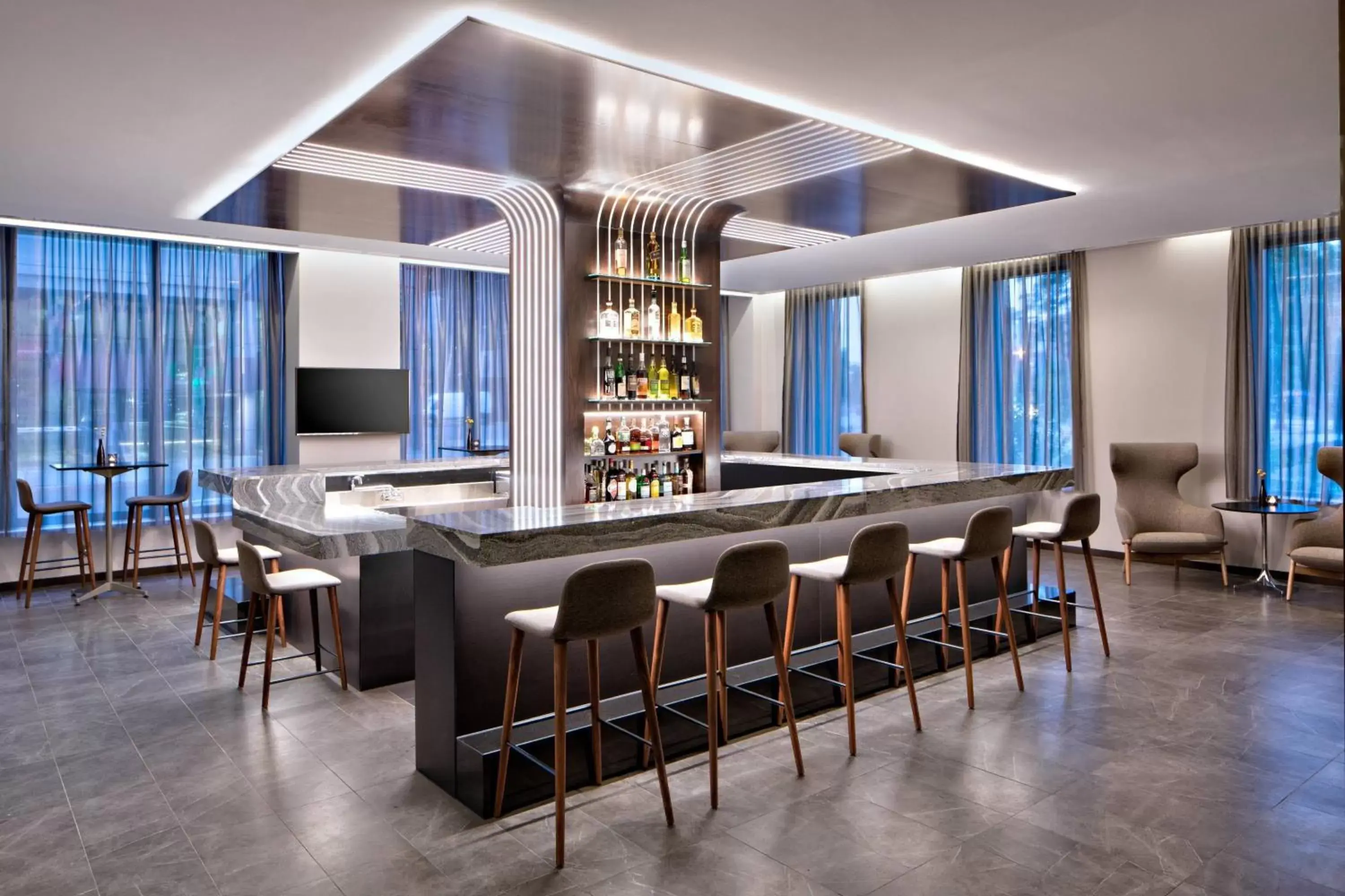 Lounge or bar in AC Hotel by Marriott Grand Rapids Downtown