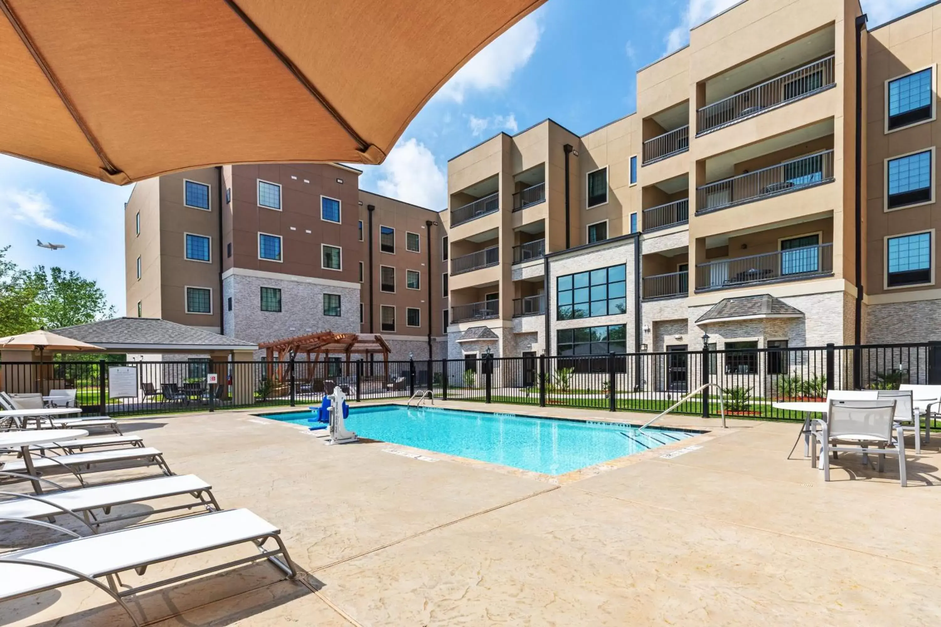 Property building, Swimming Pool in Staybridge Suites - Houston IAH Airport East, an IHG Hotel