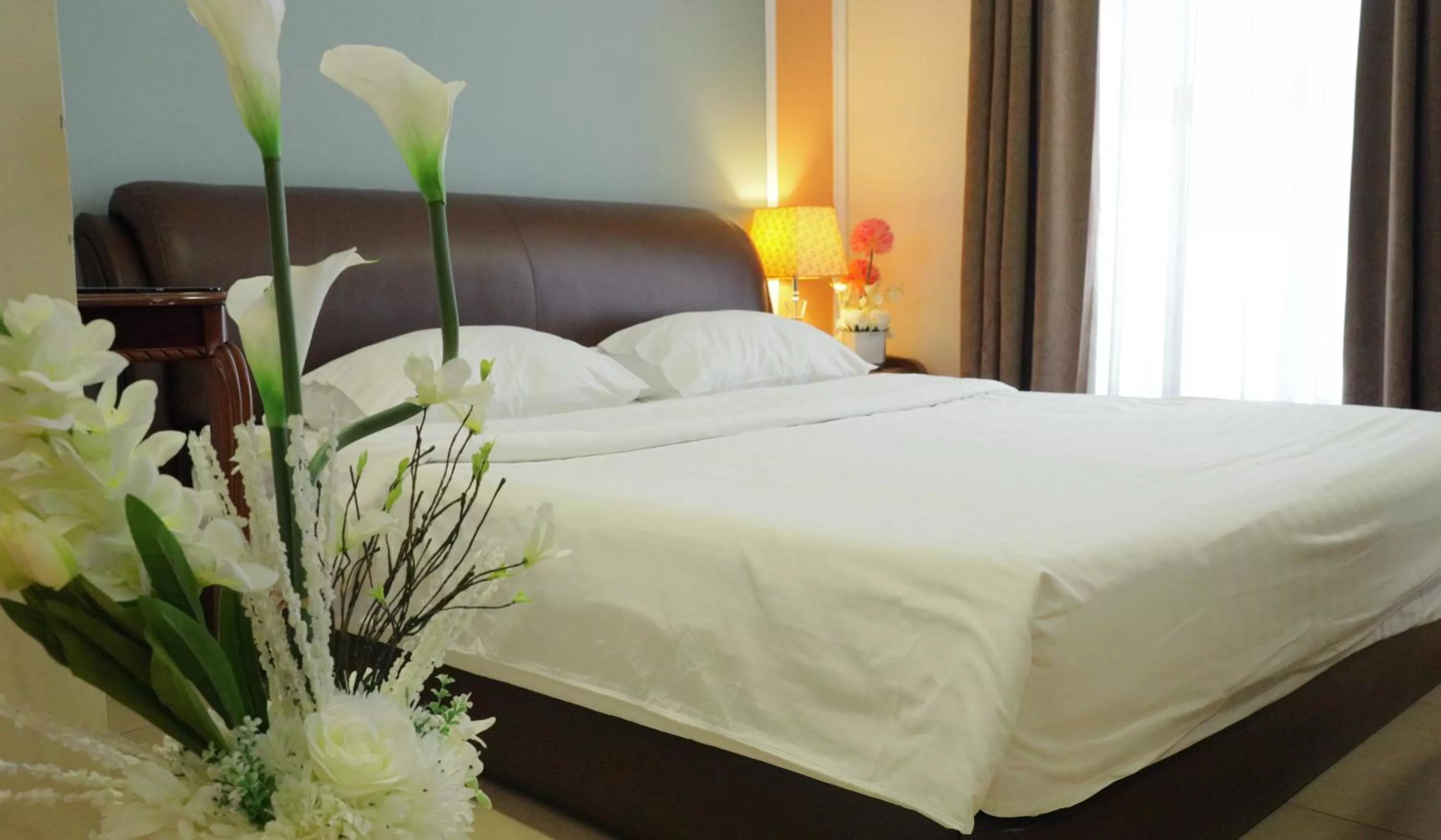 Bed in Laguna Hotel Suites