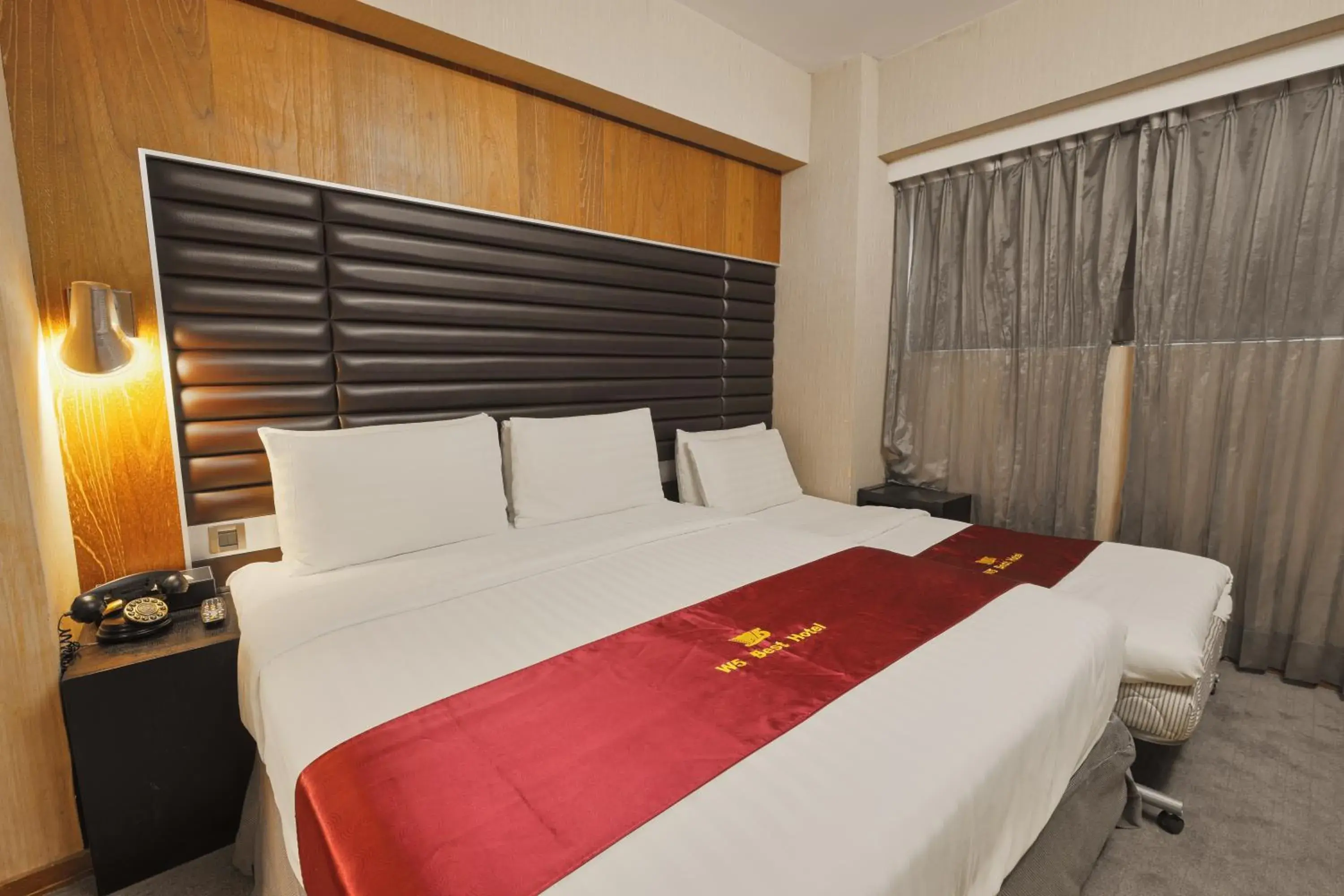 Bed in Li Duo Best Hotel