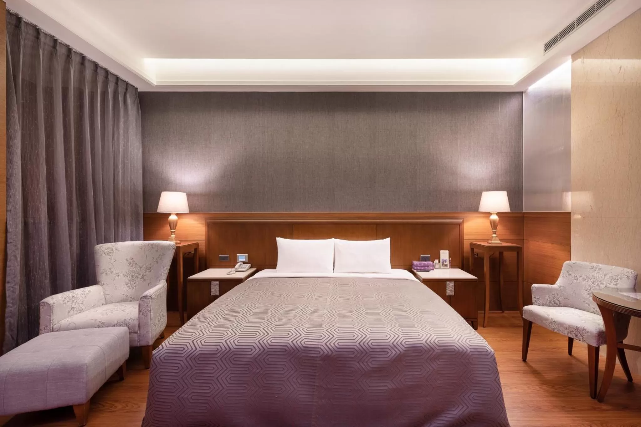 Bed in Purple Garden Motel