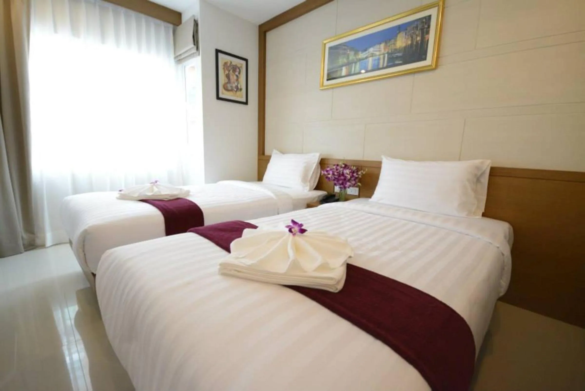 Bed in The Patong Center Hotel