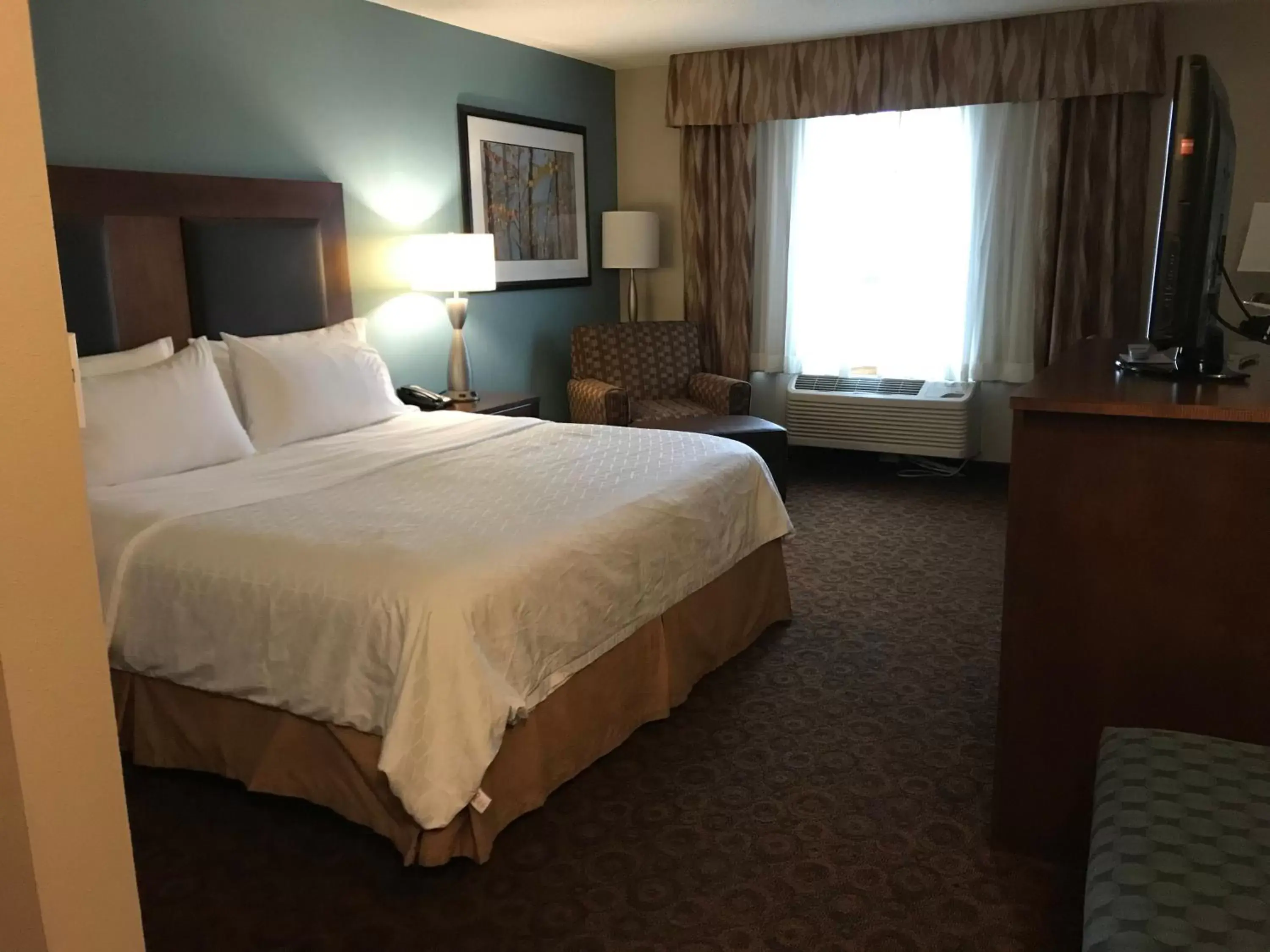 Bed in Holiday Inn Express and Suites St. Cloud, an IHG Hotel