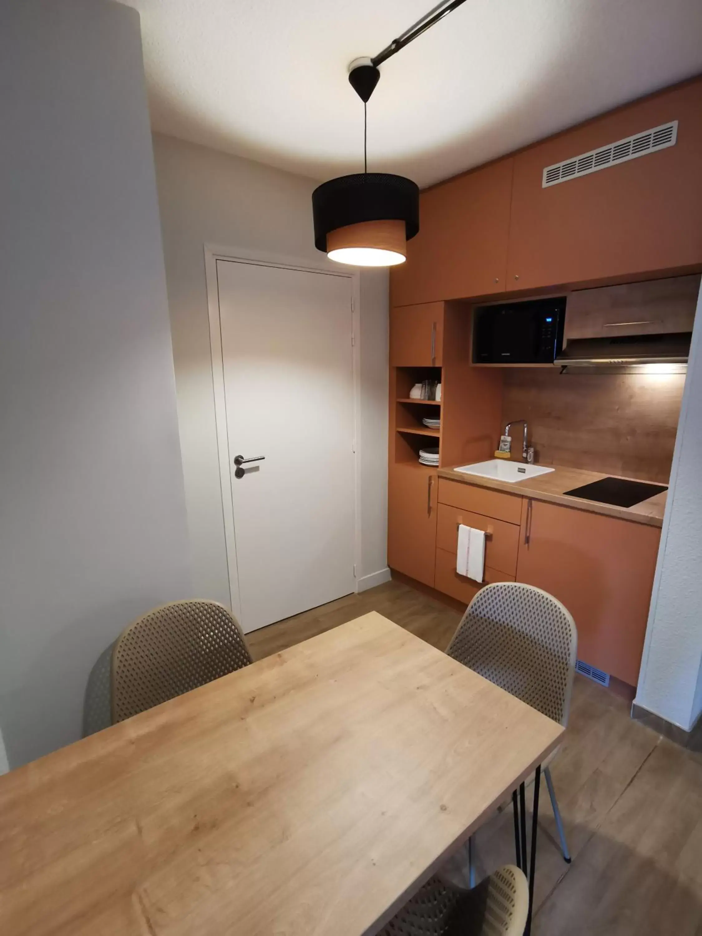 Kitchen/Kitchenette in Apparthotel Torcy