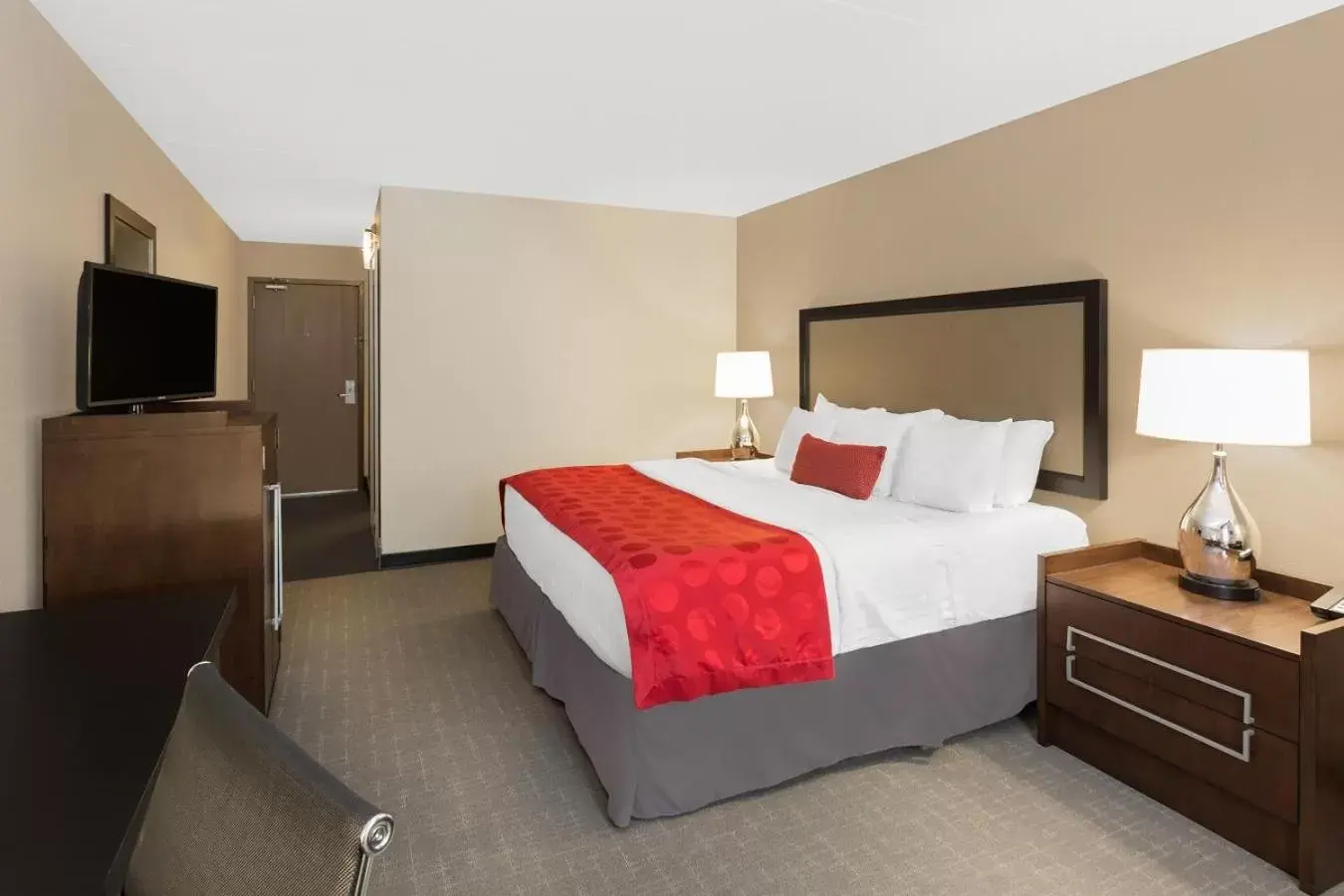 Bed in Ramada by Wyndham Des Moines Airport