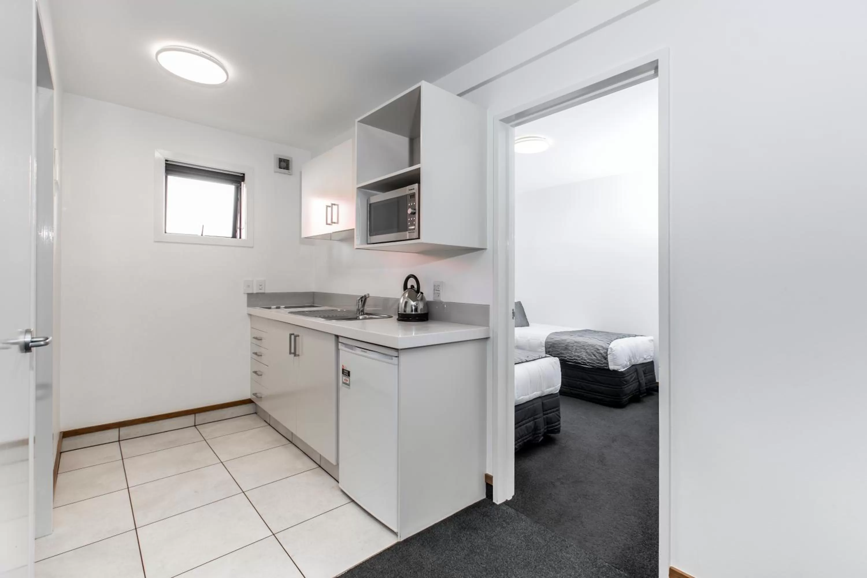 Kitchen or kitchenette in Palms Motel