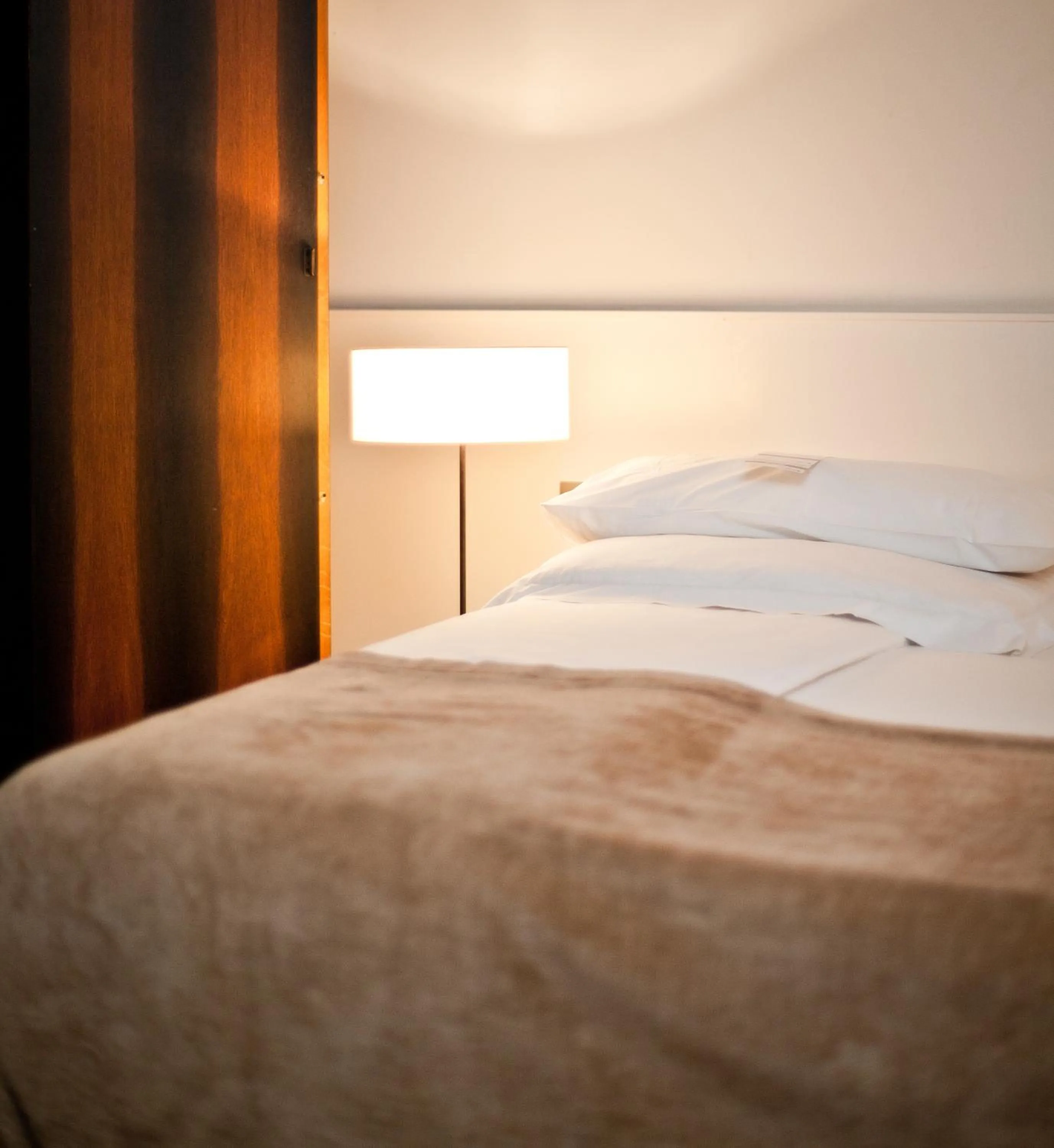 Bed in CORTIINA Hotel