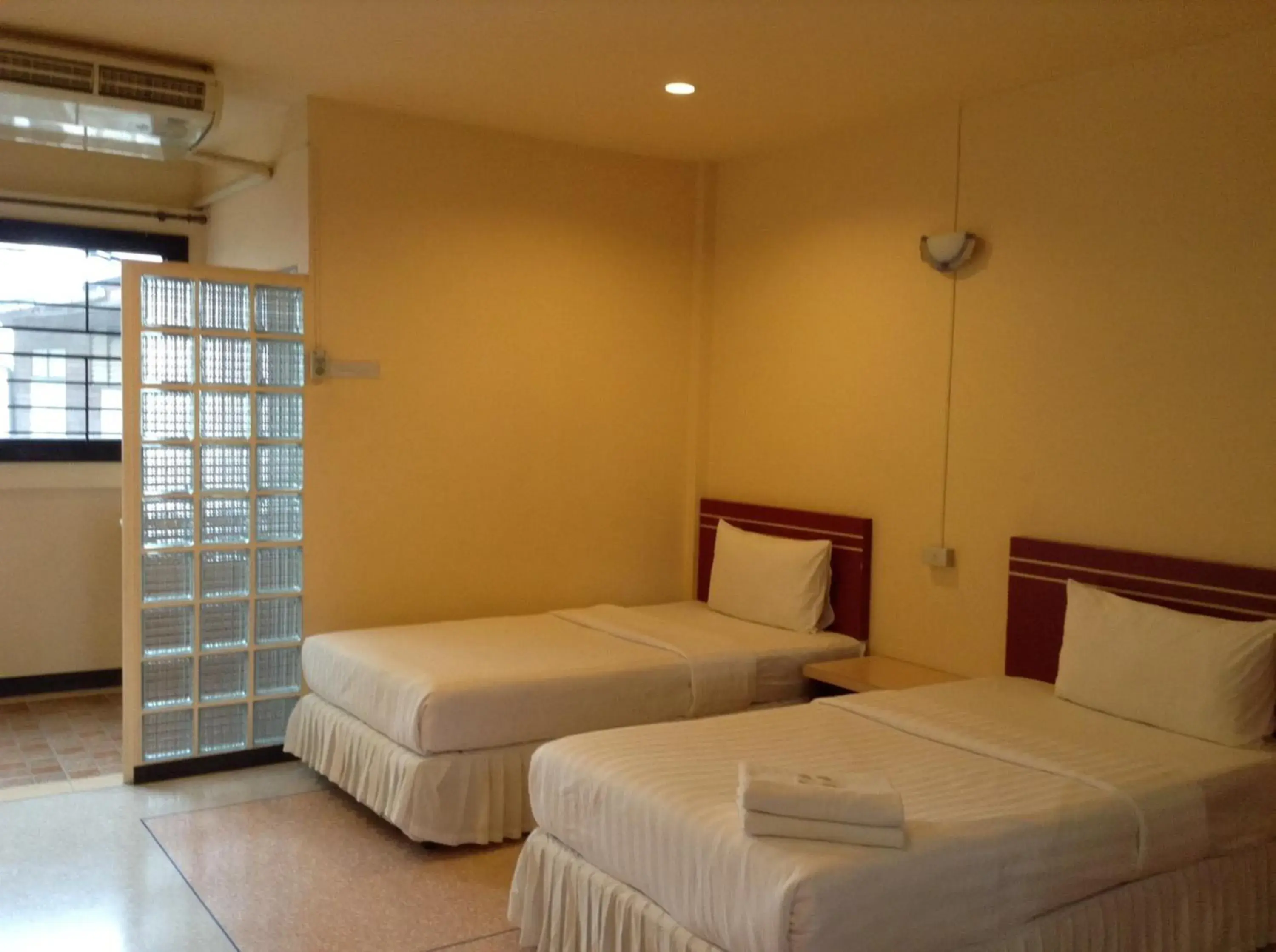 Photo of the whole room, Bed in Srisomthai Hotel