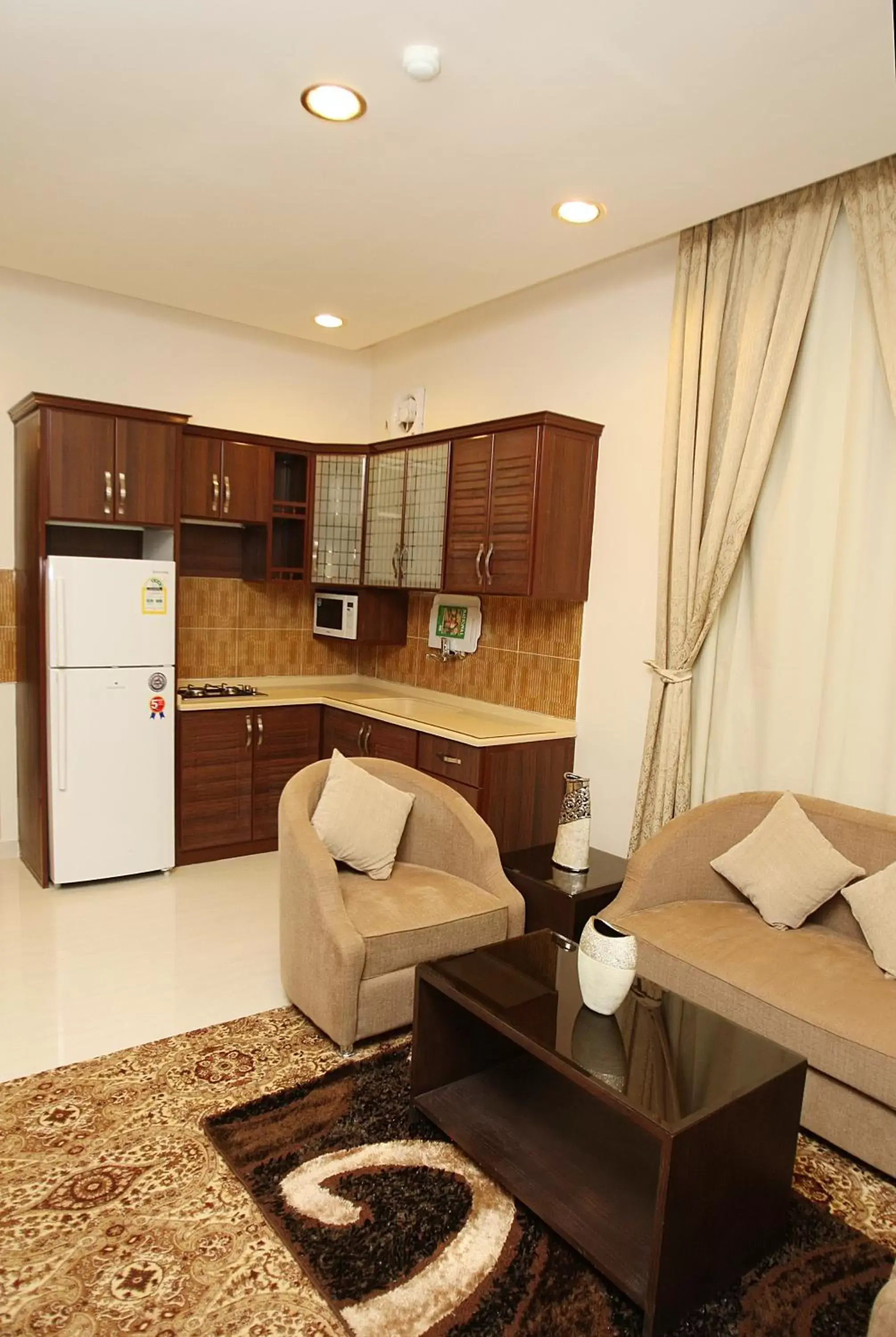 Kitchen or kitchenette, Seating Area in Rest Night Hotel Suites- - AL Nafal