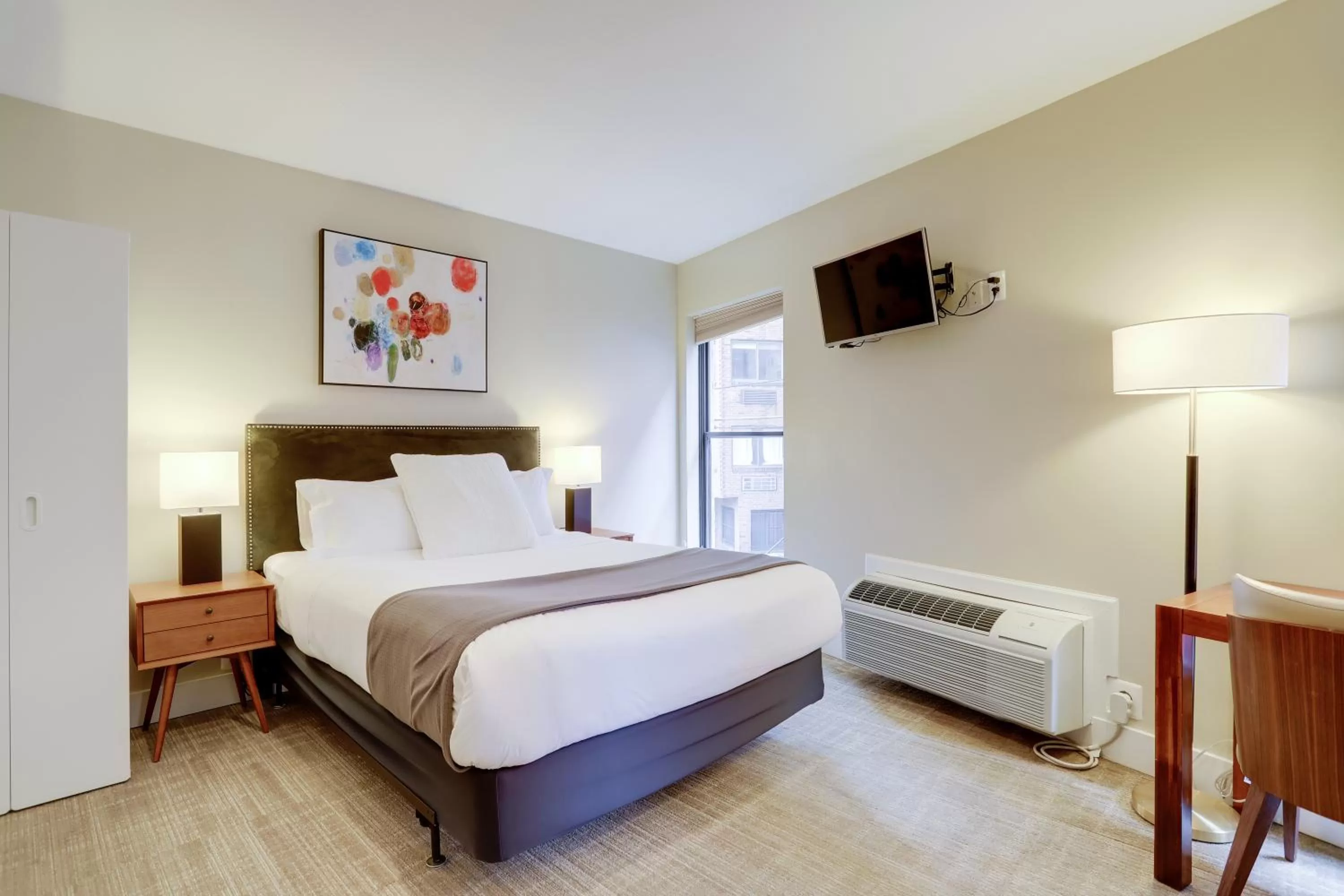 Bed in Sojourn at DuPont Place
