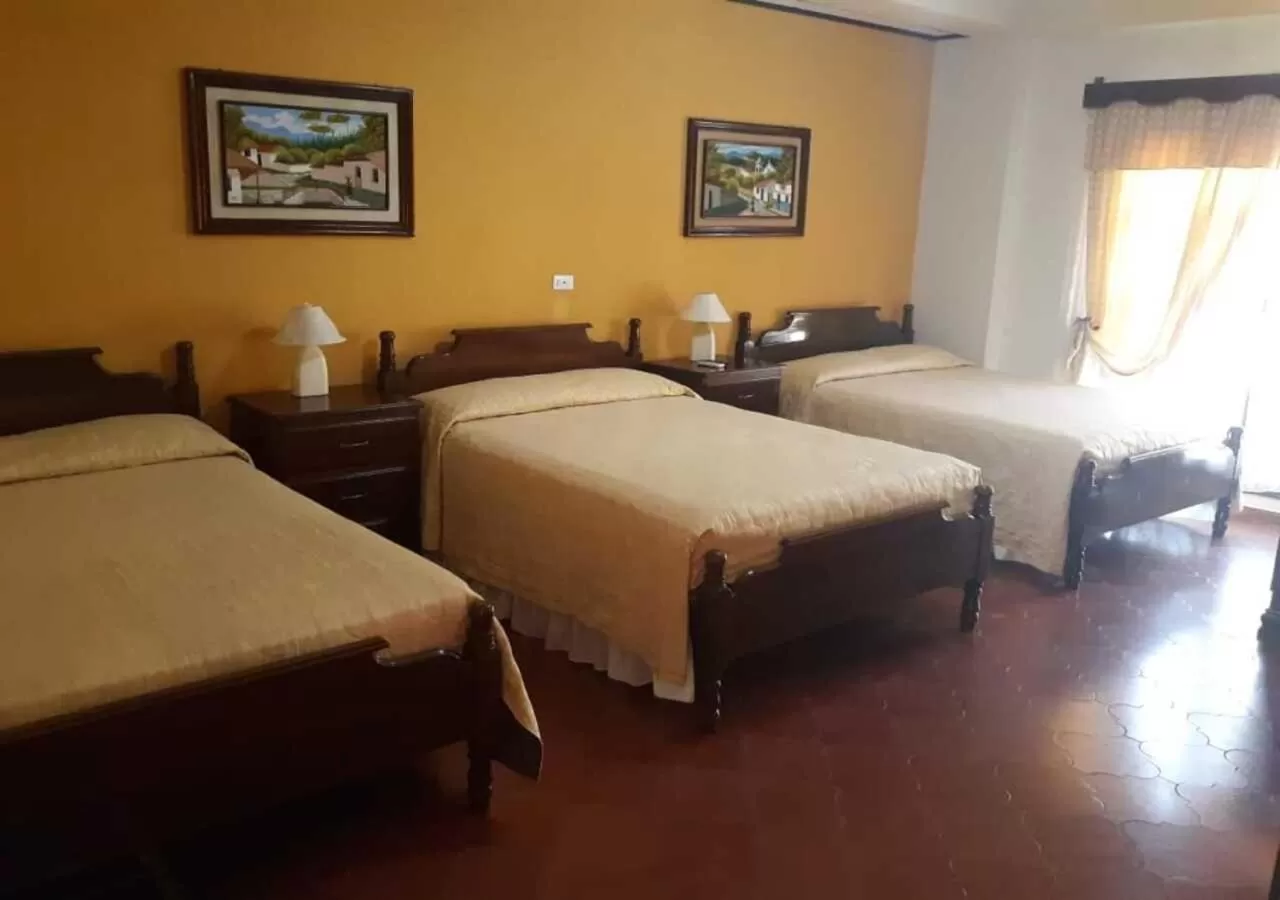 Bed in Hotel Acropolis Maya