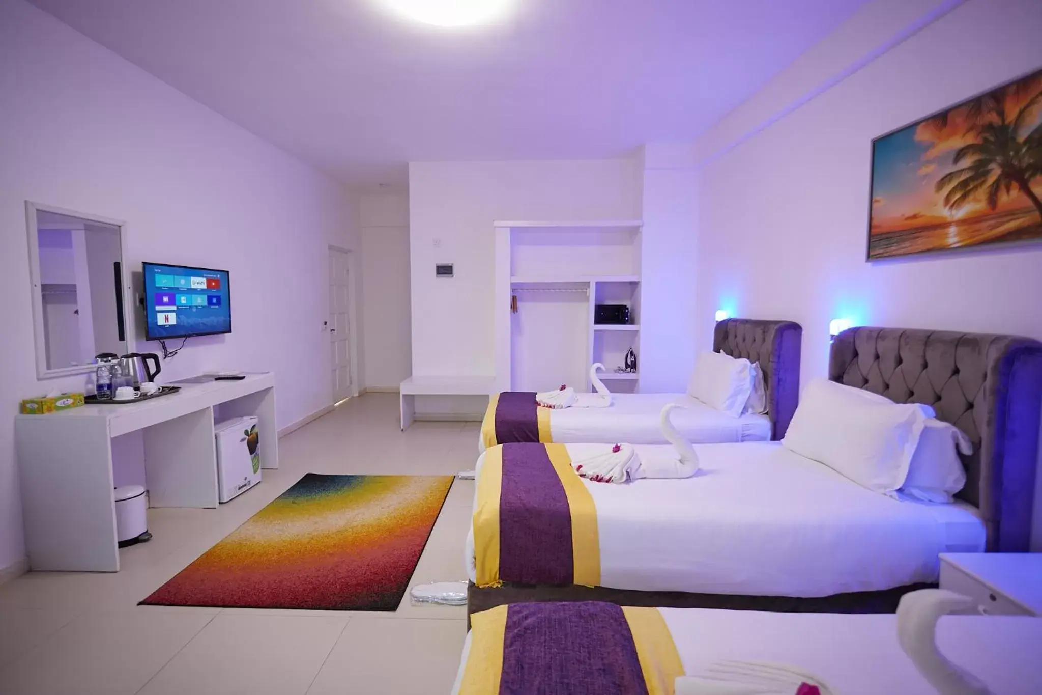 Bed, TV/Entertainment Center in Canary Nungwi Hotel & Free SPA