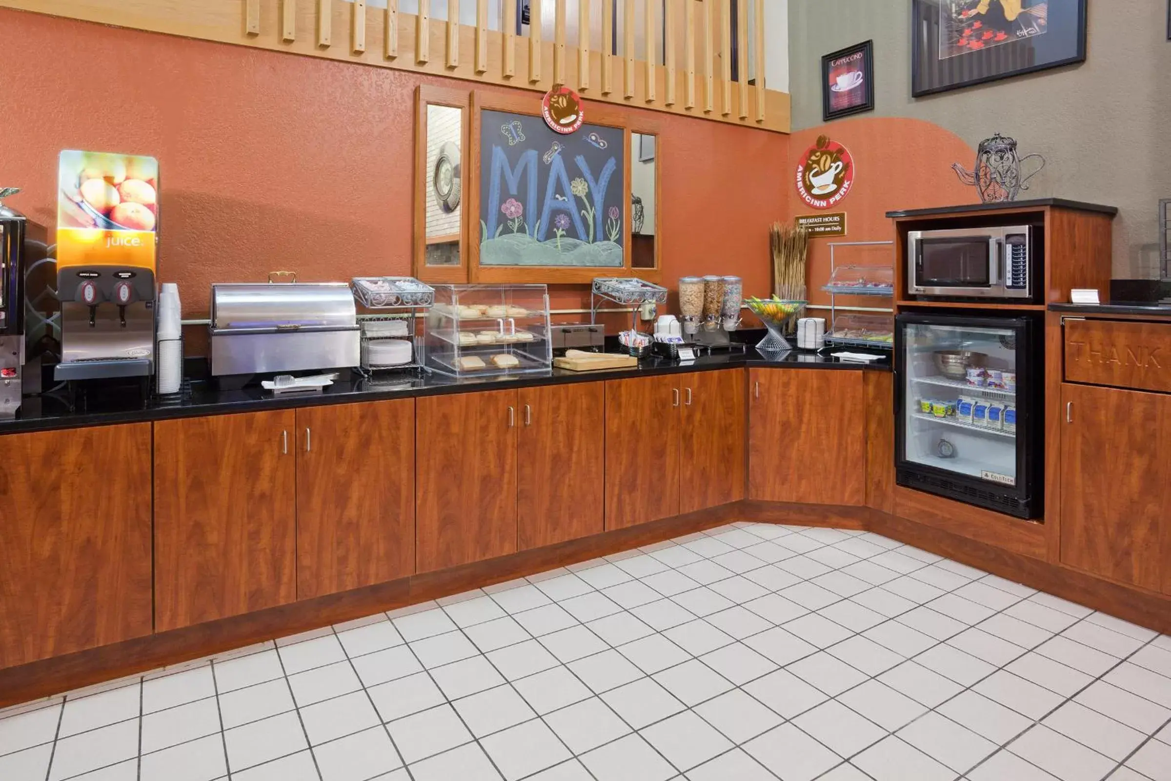 Communal kitchen in AmericInn by Wyndham Albert Lea