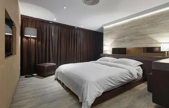 Bed in JBG Hot Spring Resort Hotel