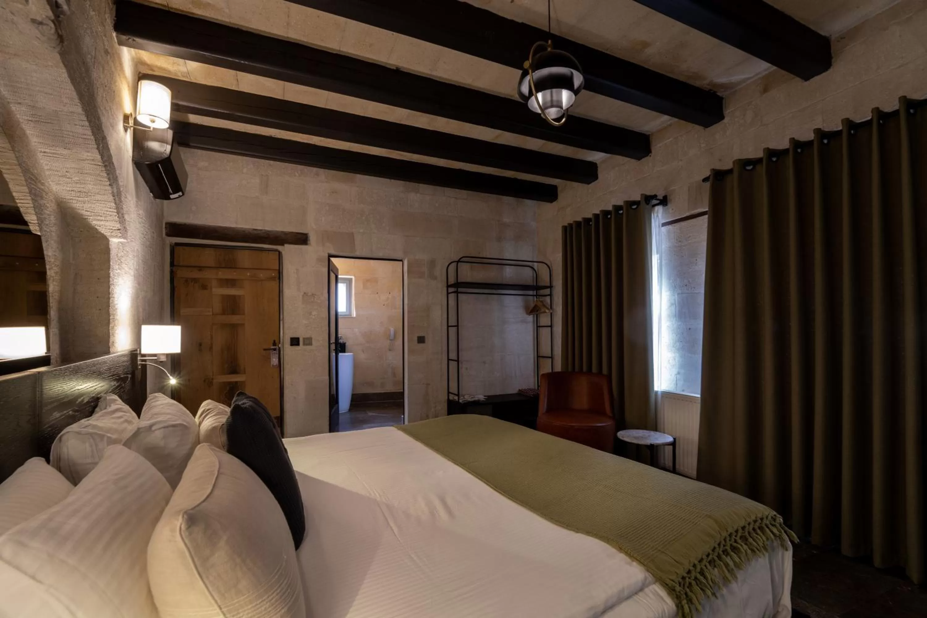 Bedroom, Bed in Artemis Cave Suites & Spa- Adults Only