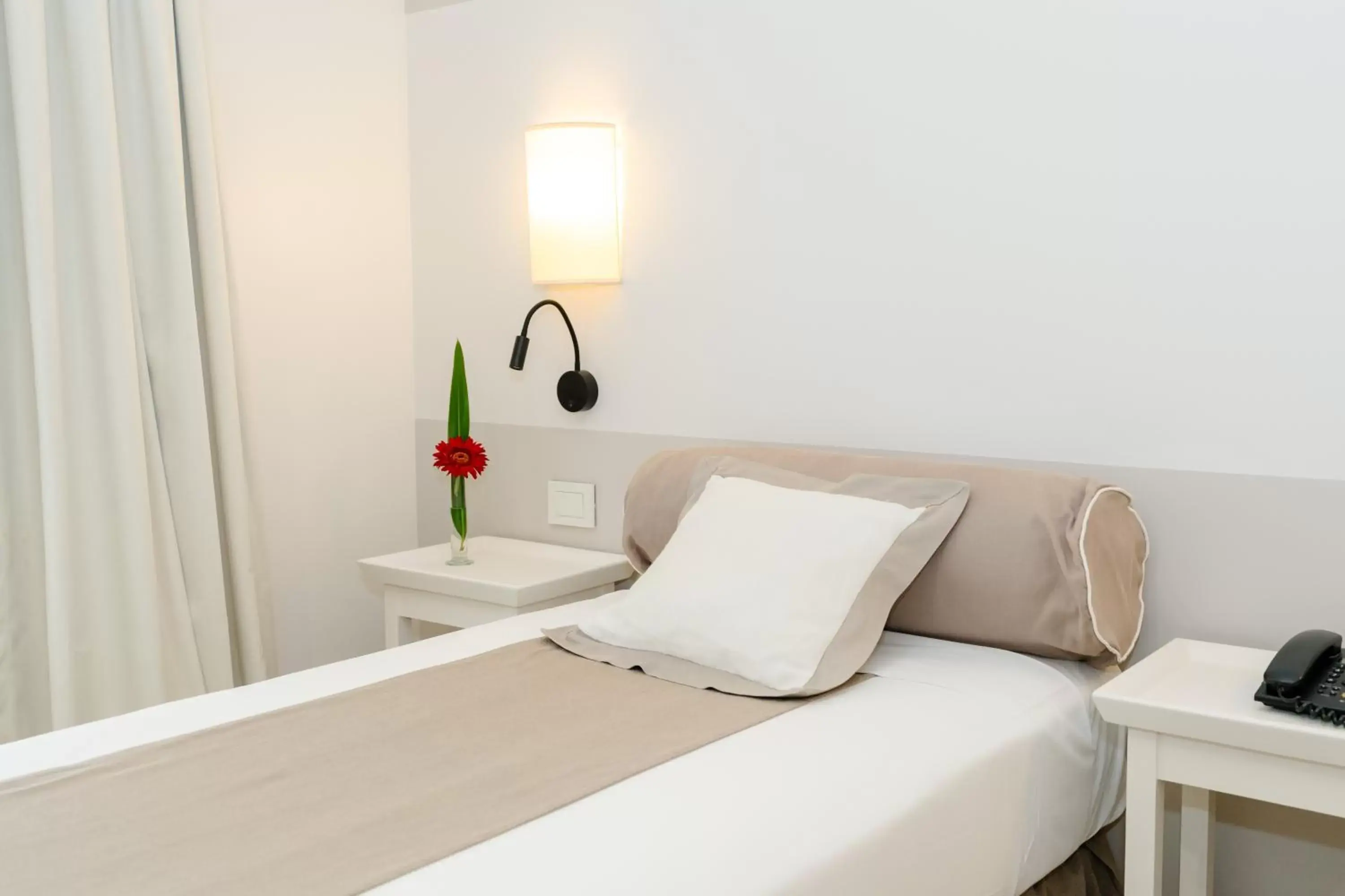 Bed in Loi Suites Recoleta Hotel