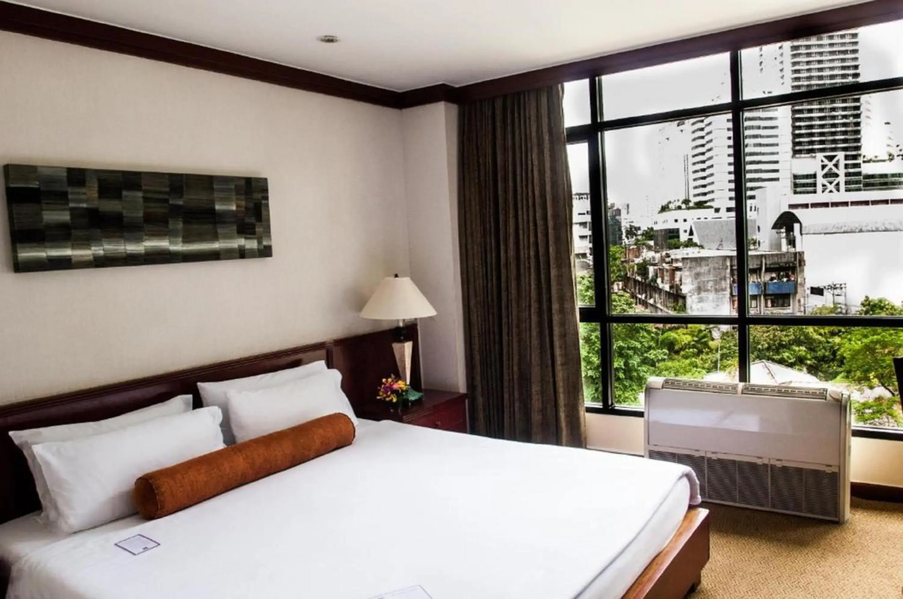 Bed in City Lodge Bangkok
