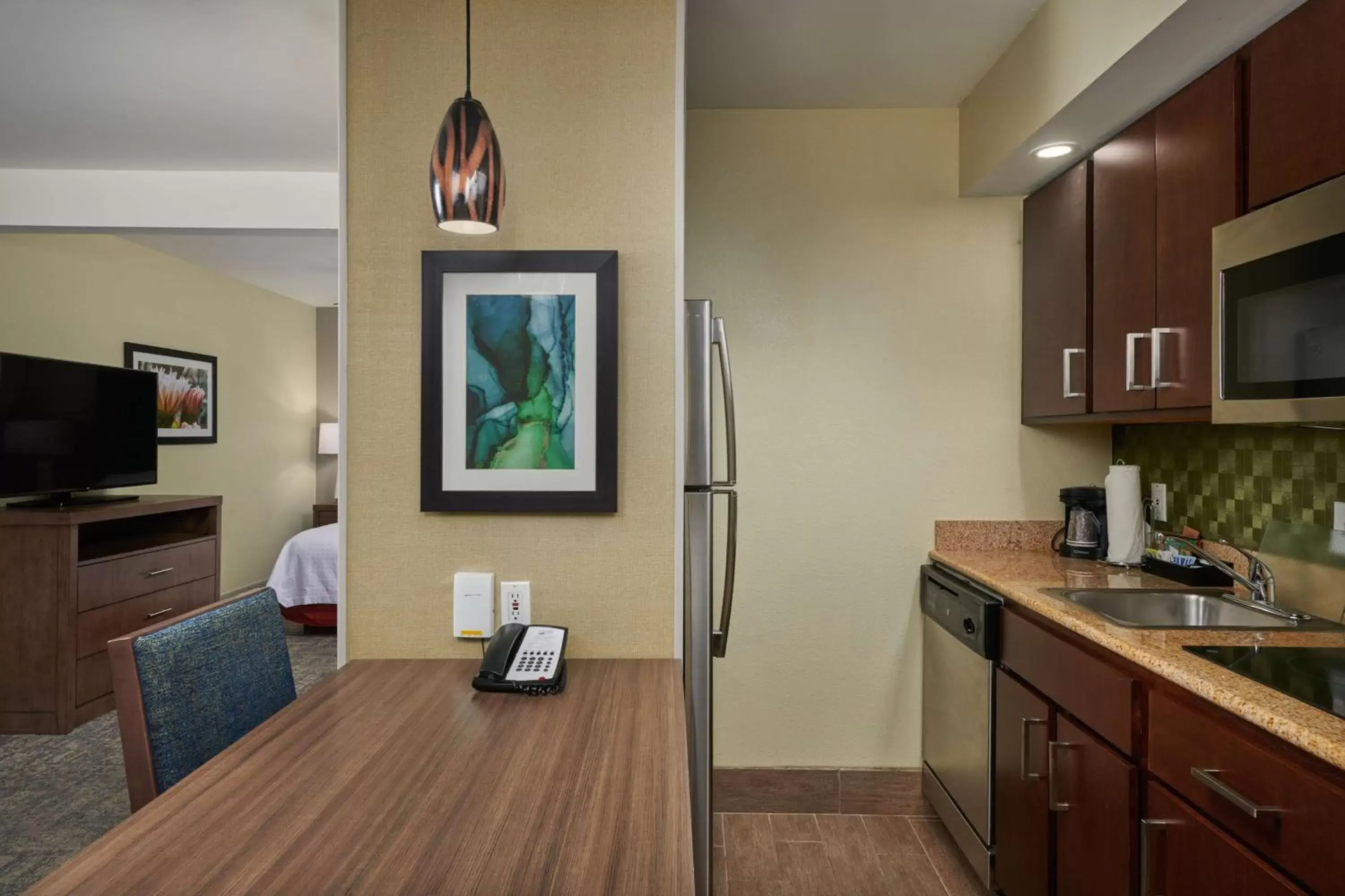 Bedroom, Kitchen/Kitchenette in Homewood Suites by Hilton Sarasota