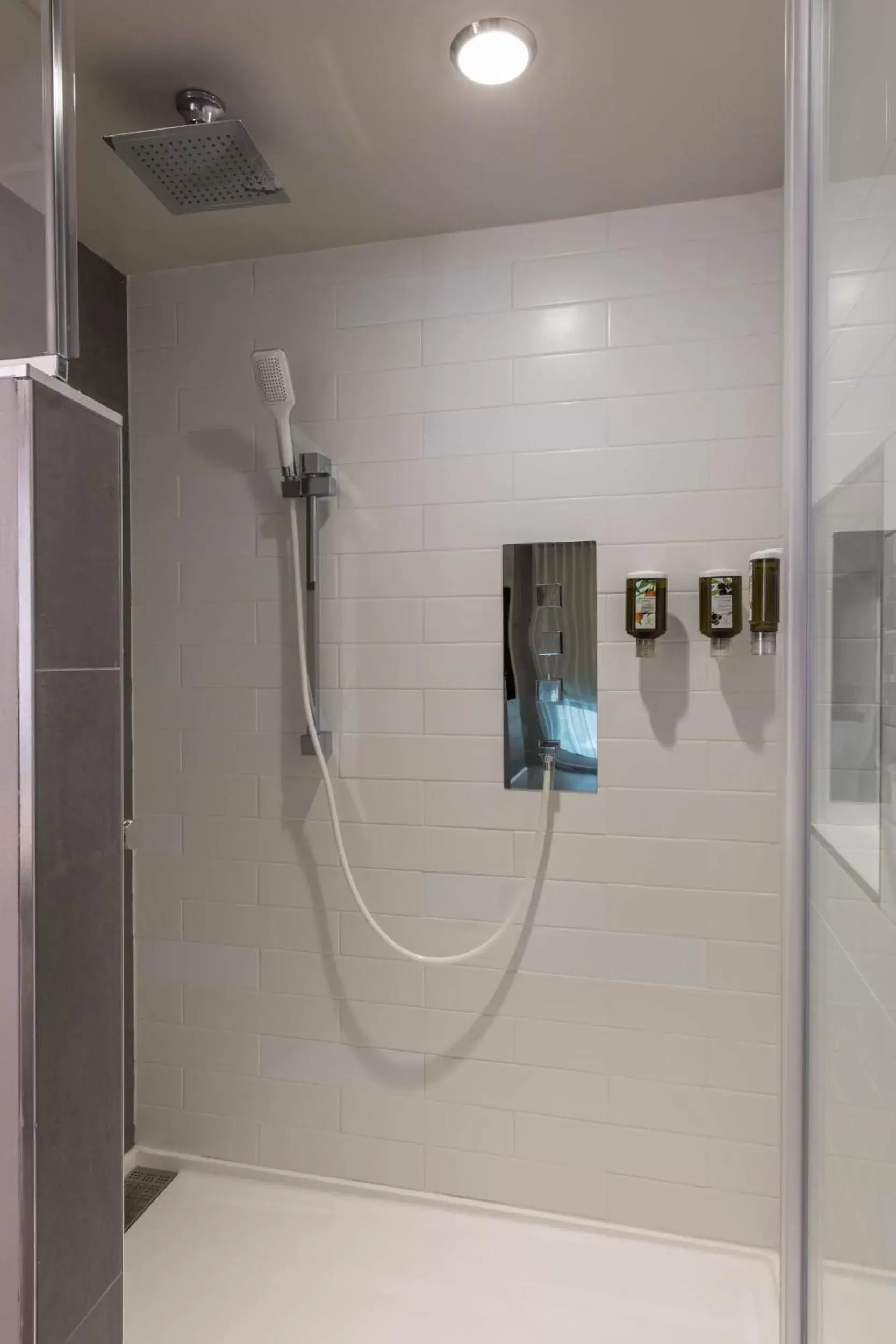 Shower, Bathroom in Hôtel & Suites Normandin Québec