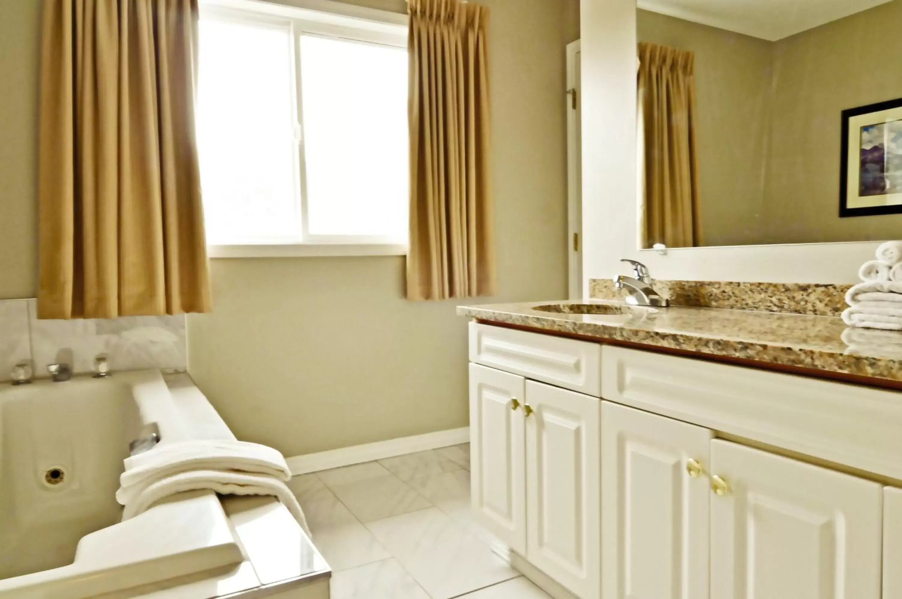 Bathroom in Travelodge by Wyndham Golden Sportsman Lodge