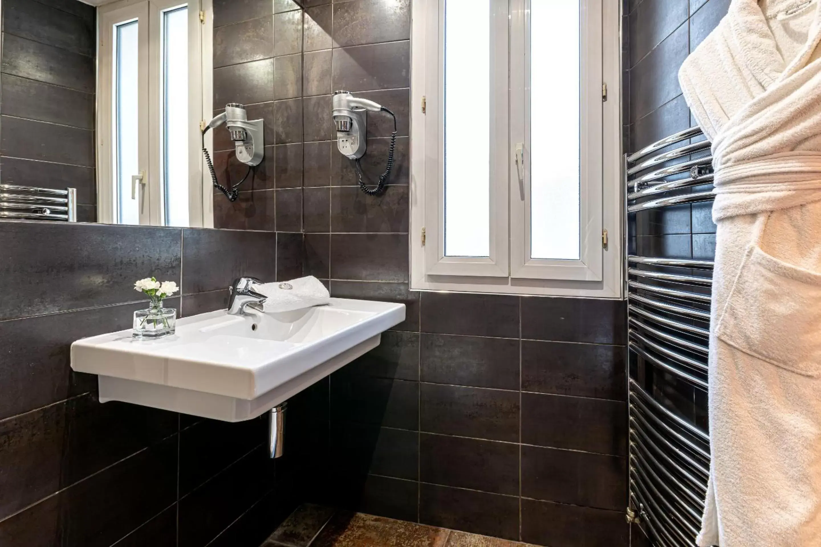 Bathroom in Hotel Ariane Montparnasse by Patrick Hayat
