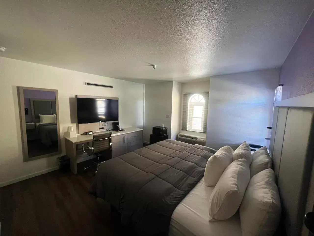 Bedroom in The Aqua Pacific Hotel