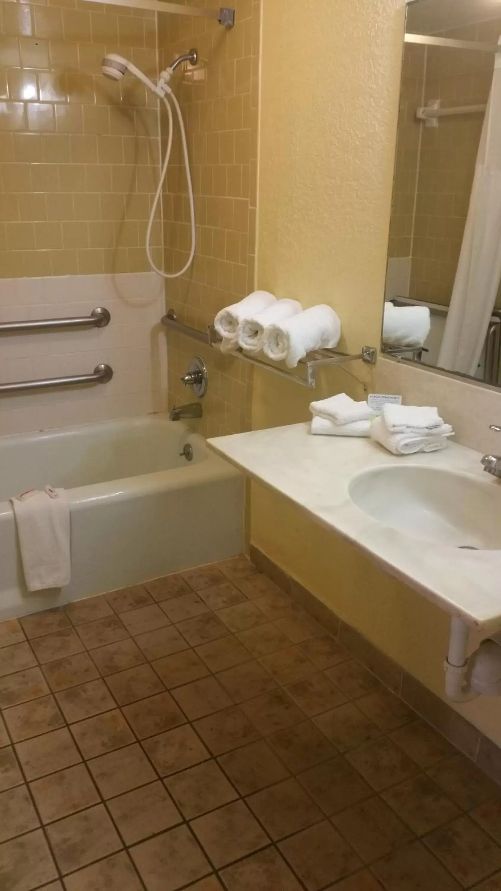 Bathroom in Days Inn by Wyndham Cocoa Cruiseport West At I-95/524