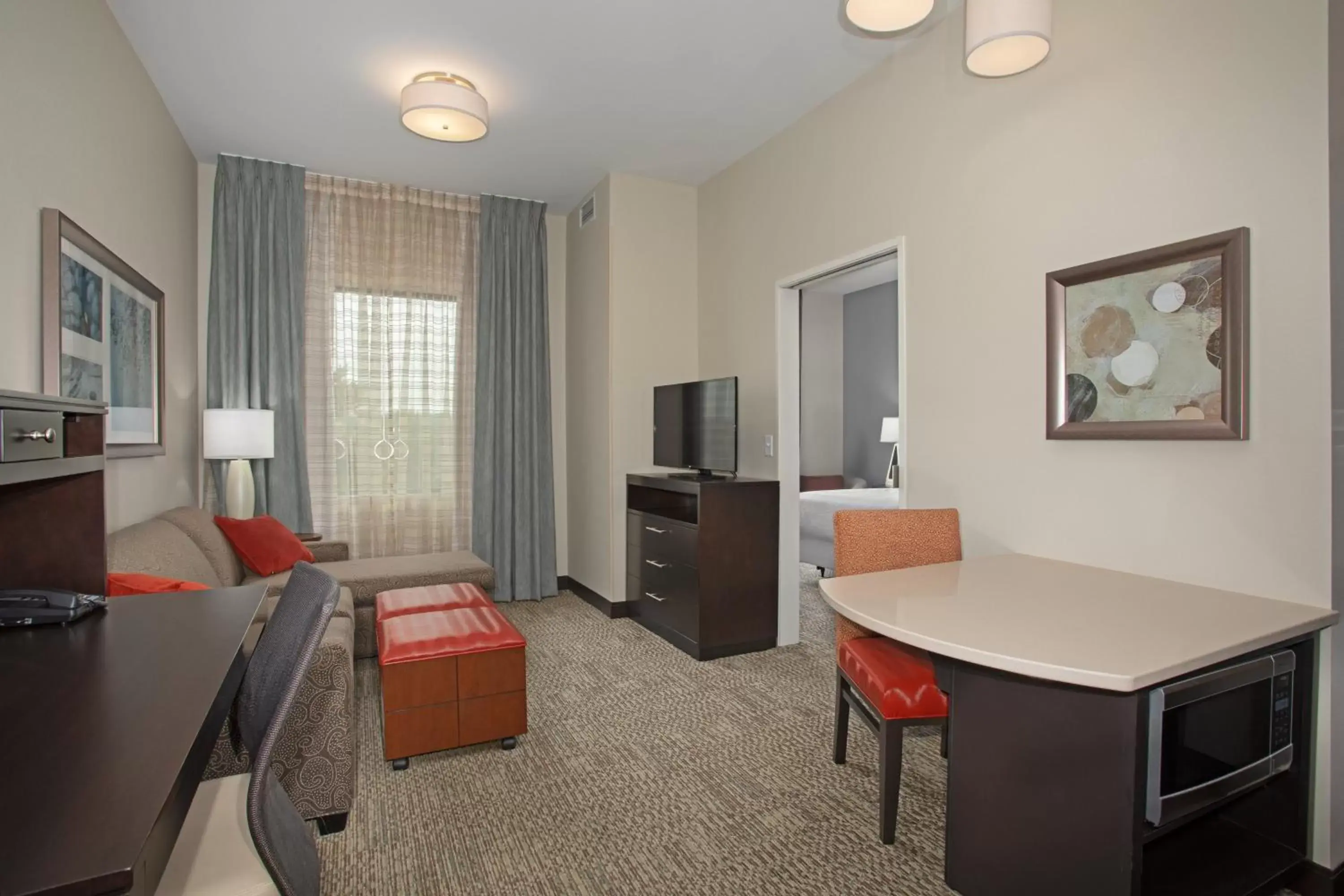 Photo of the whole room, TV/Entertainment Center in Staybridge Suites Denver South - Highlands Ranch, an IHG Hotel