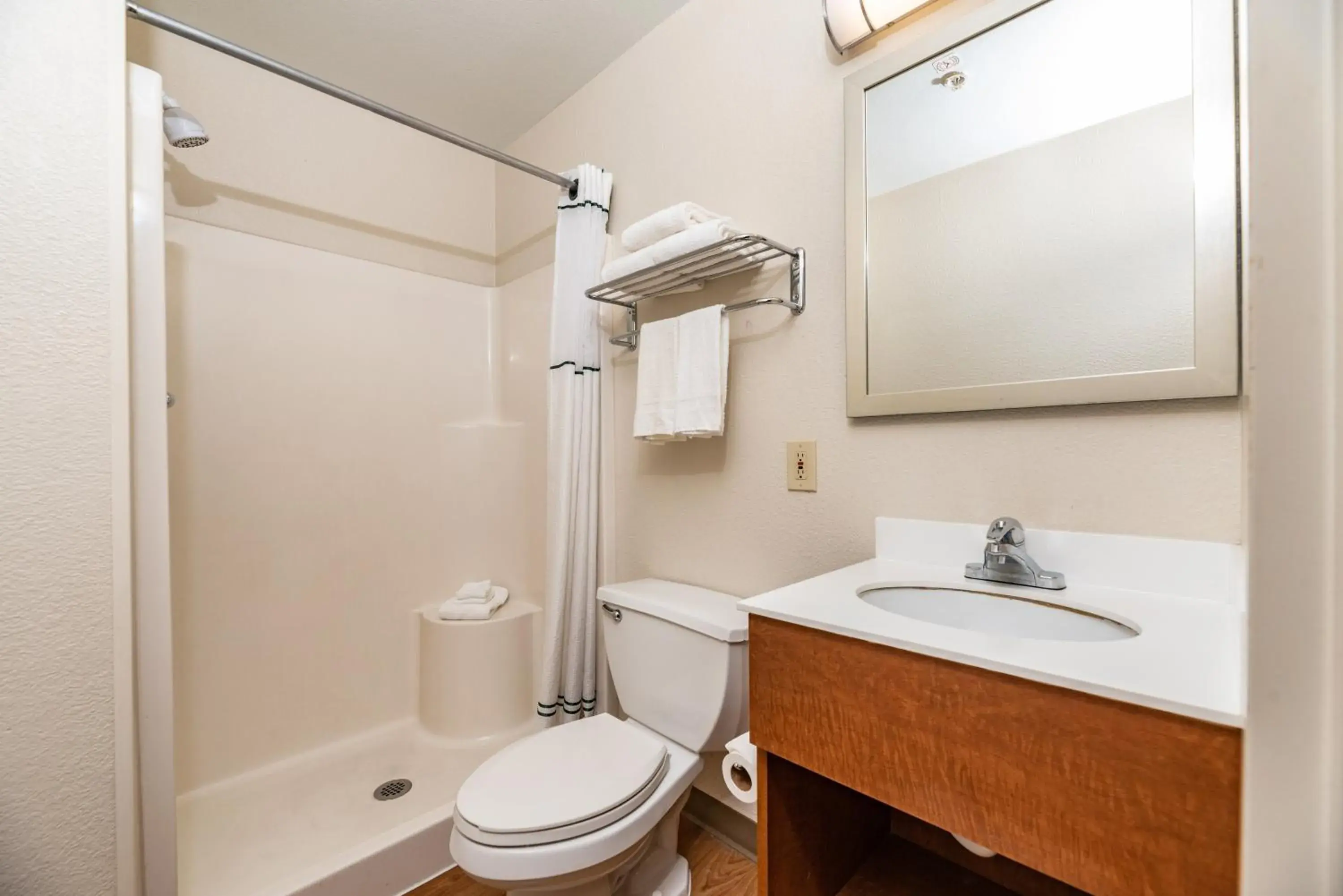 Bathroom in HomeTowne Studios by Red Roof Fresno - West