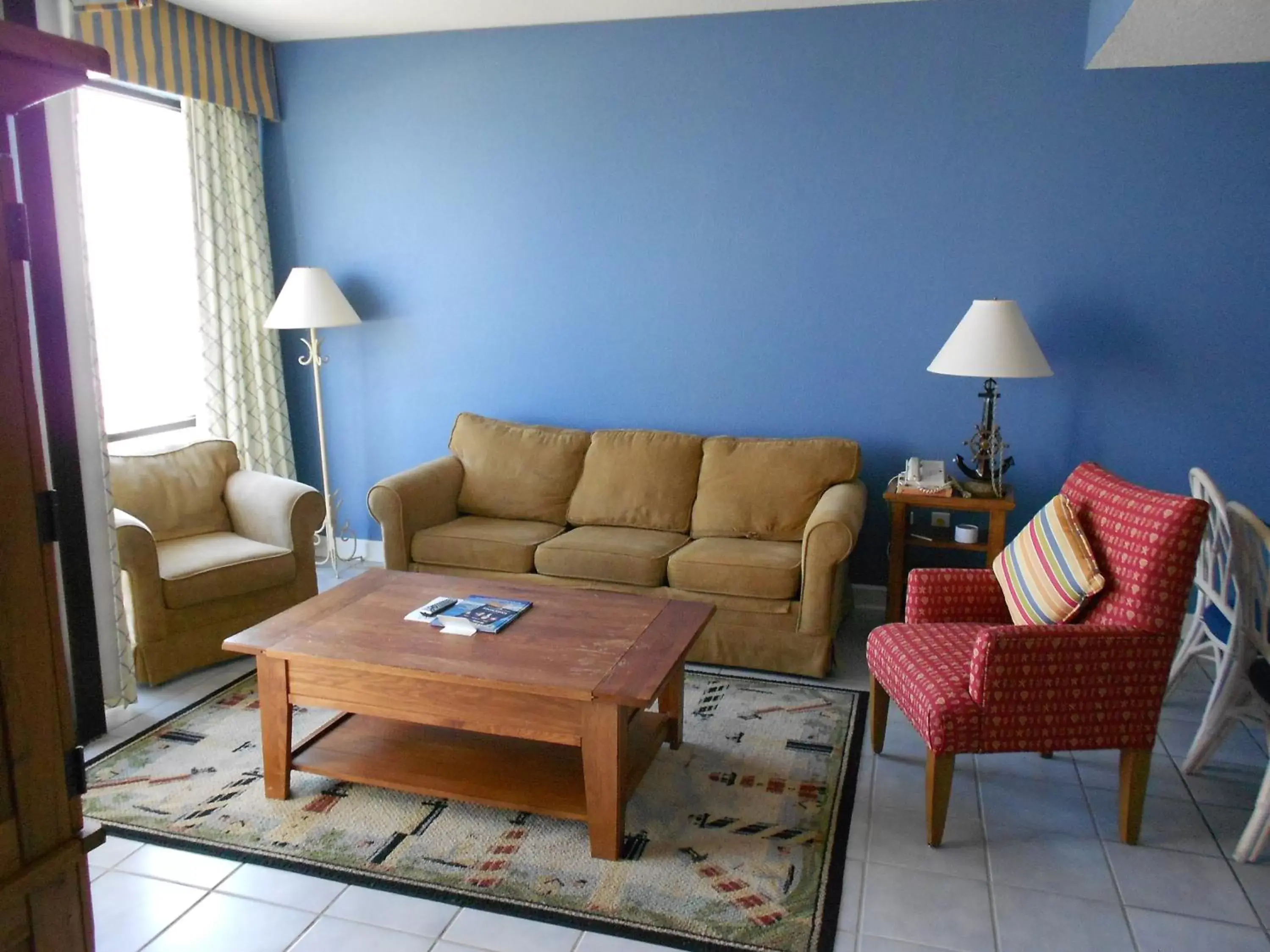 Living room, Seating Area in Ocean Club Resort Myrtle Beach a Ramada by Wyndham