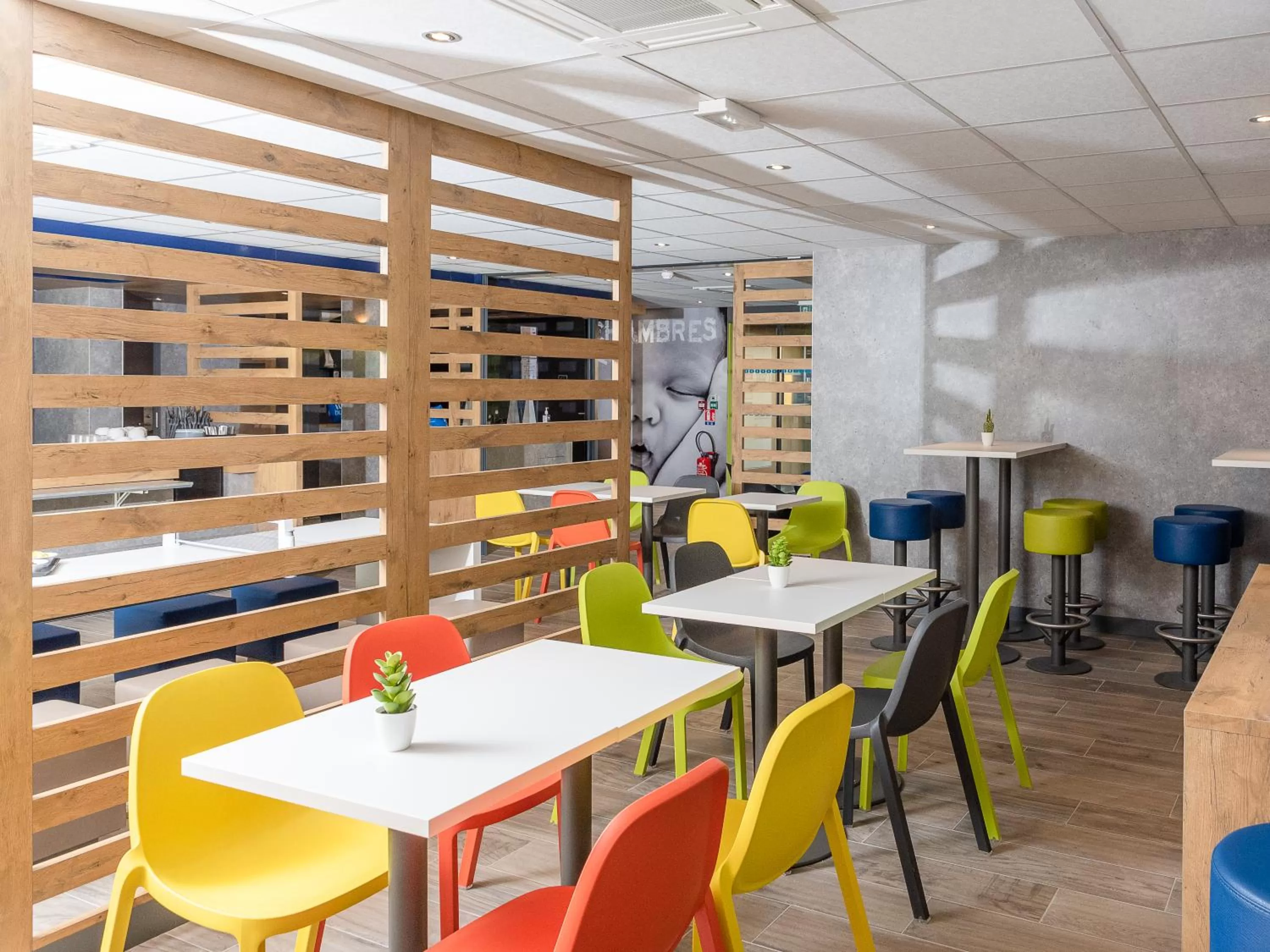 Communal lounge/ TV room in ibis Budget Cognac