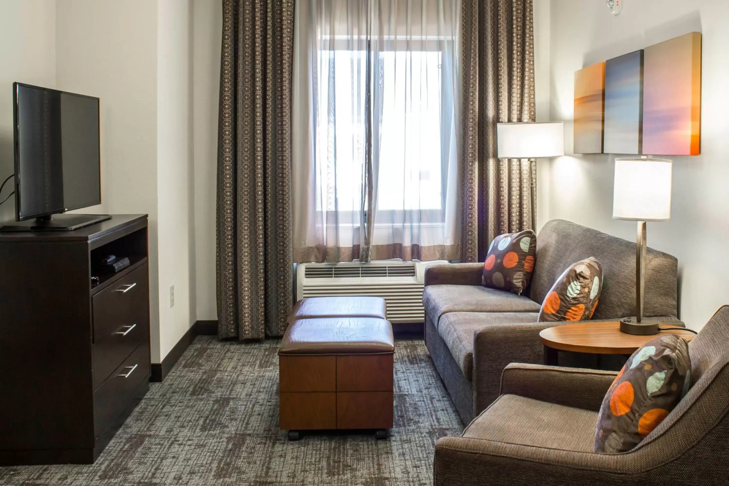 Photo of the whole room, Seating Area in Staybridge Suites North Jacksonville, an IHG Hotel