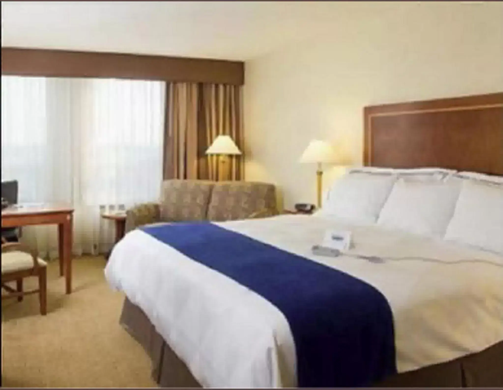 Bed in Hotel Executive Suites
