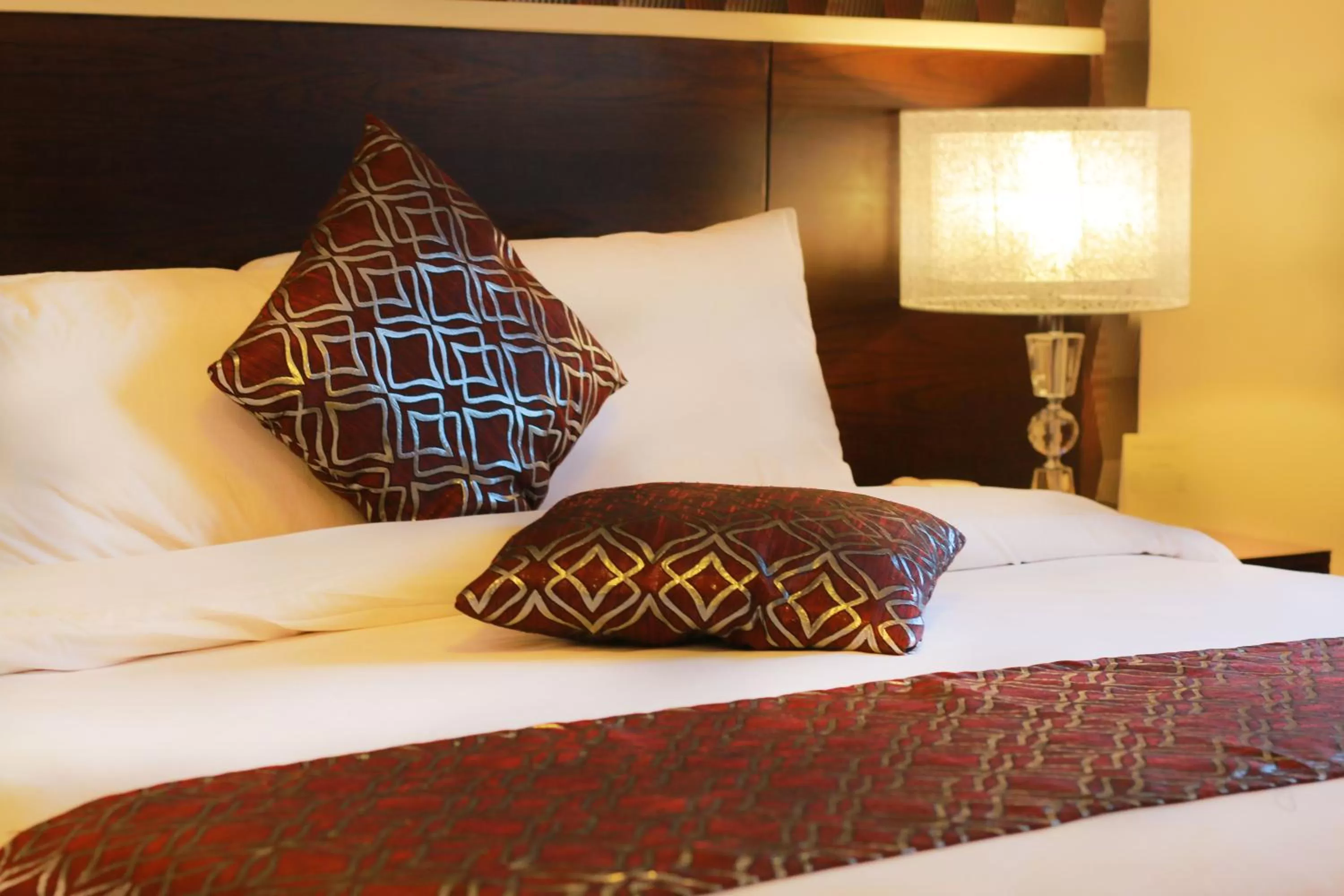 Bed in City Rose Hotel Suites