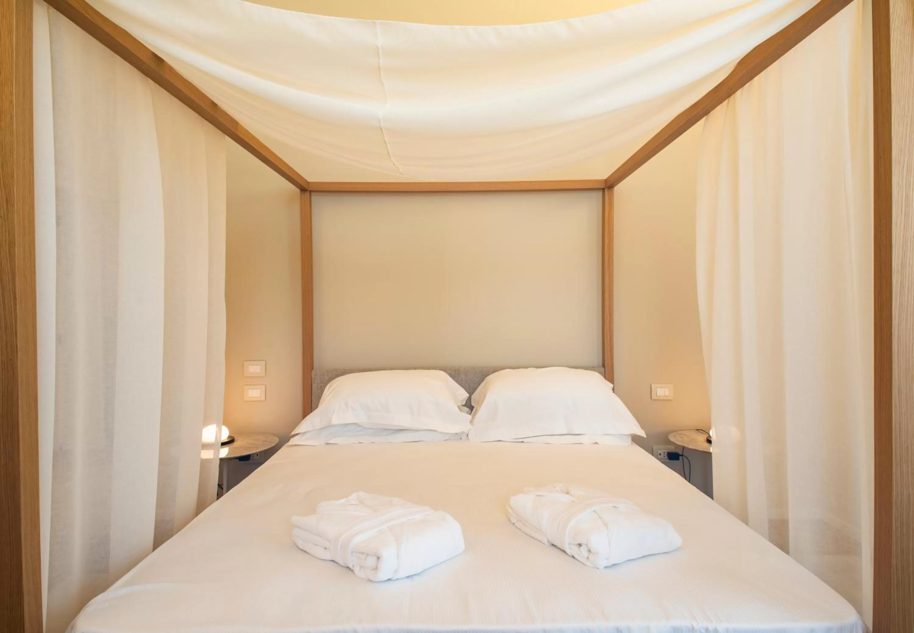 Bed in Dimora de Matera Luxury Suites