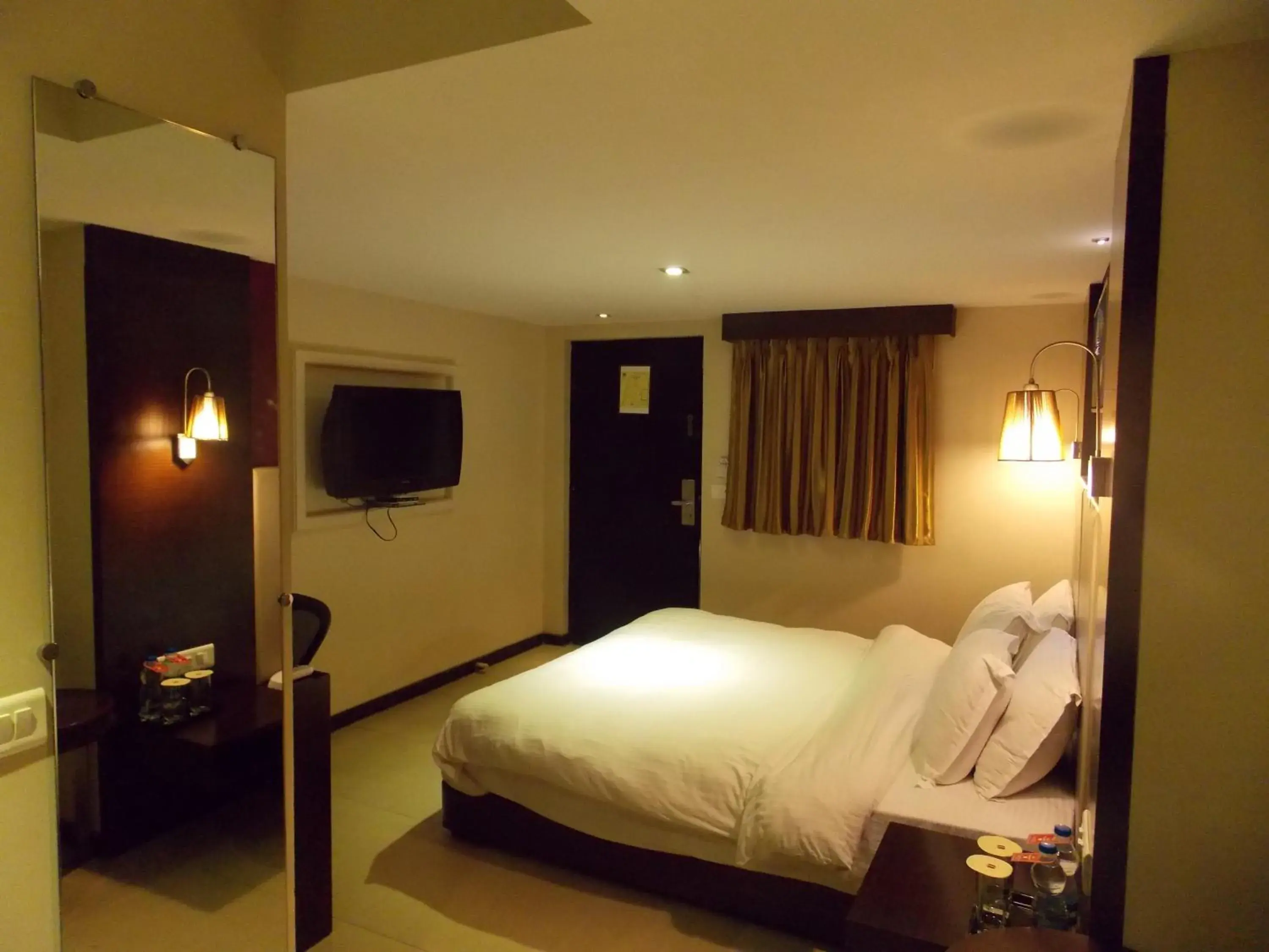 Photo of the whole room, Bed in Lords Plaza Surat