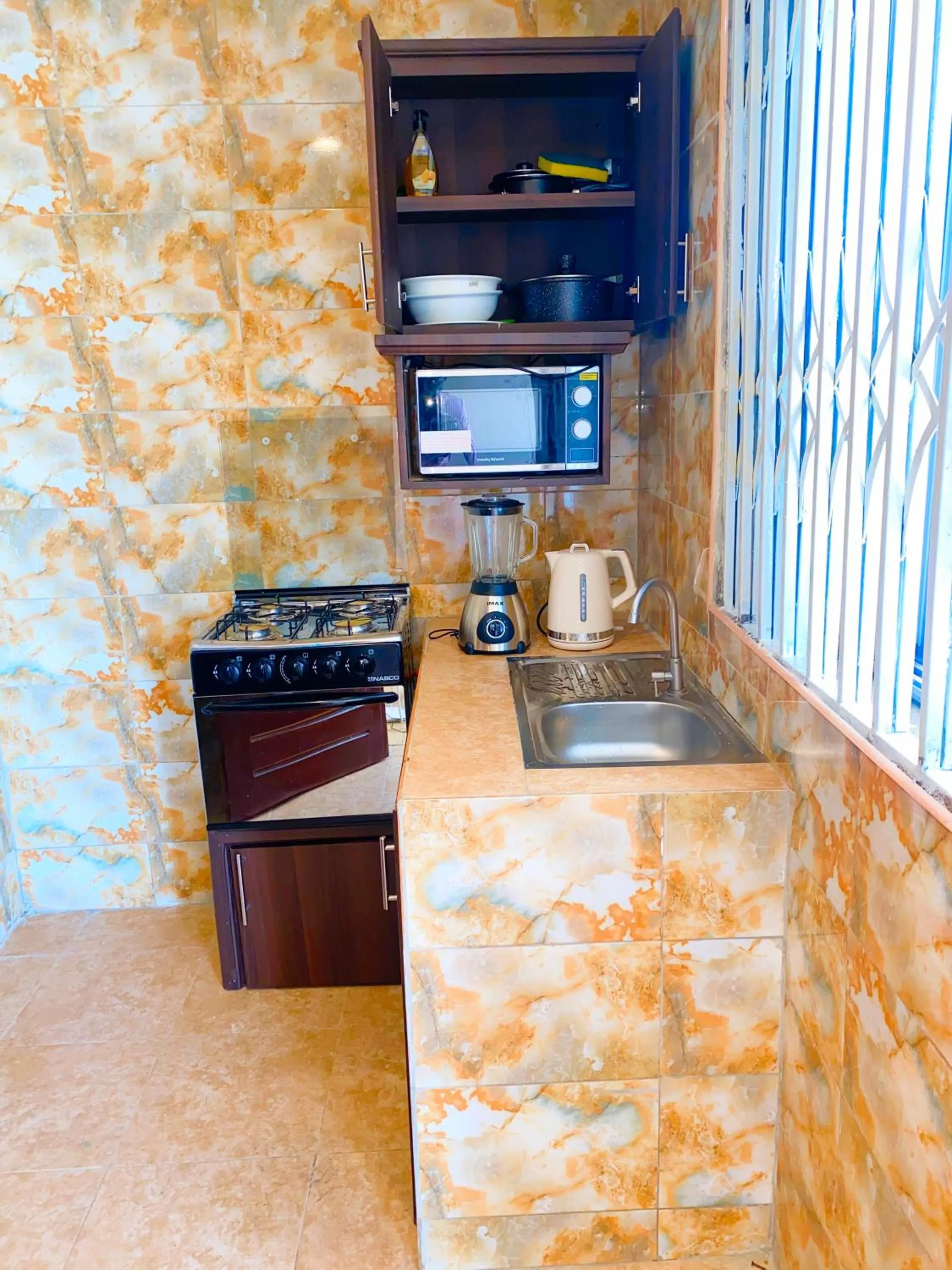 Kitchen or kitchenette in AIDEN HOMES AND APARTMENTS HOTEl