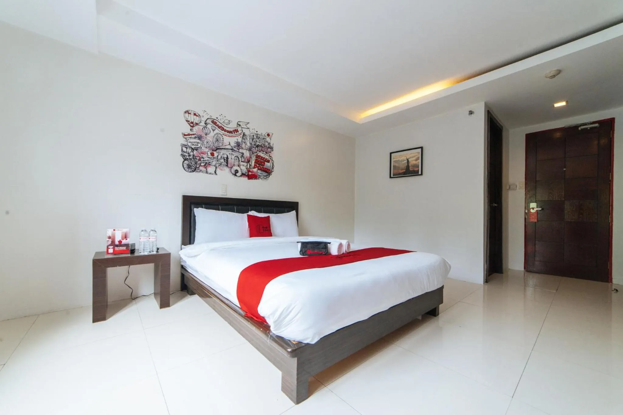 Bedroom, Bed in RedDoorz Plus at One Liberty Hotel Kalayaan Avenue