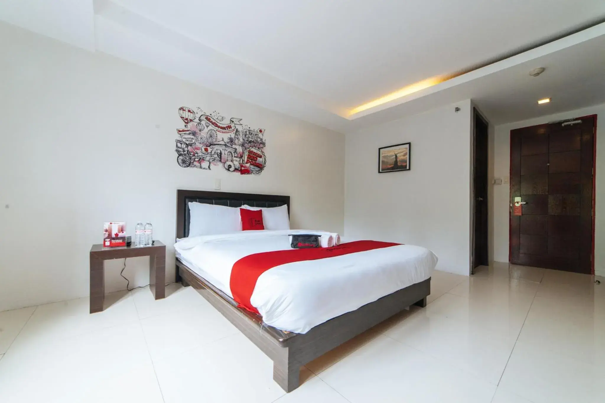 Bedroom, Bed in RedDoorz Plus at One Liberty Hotel Kalayaan Avenue