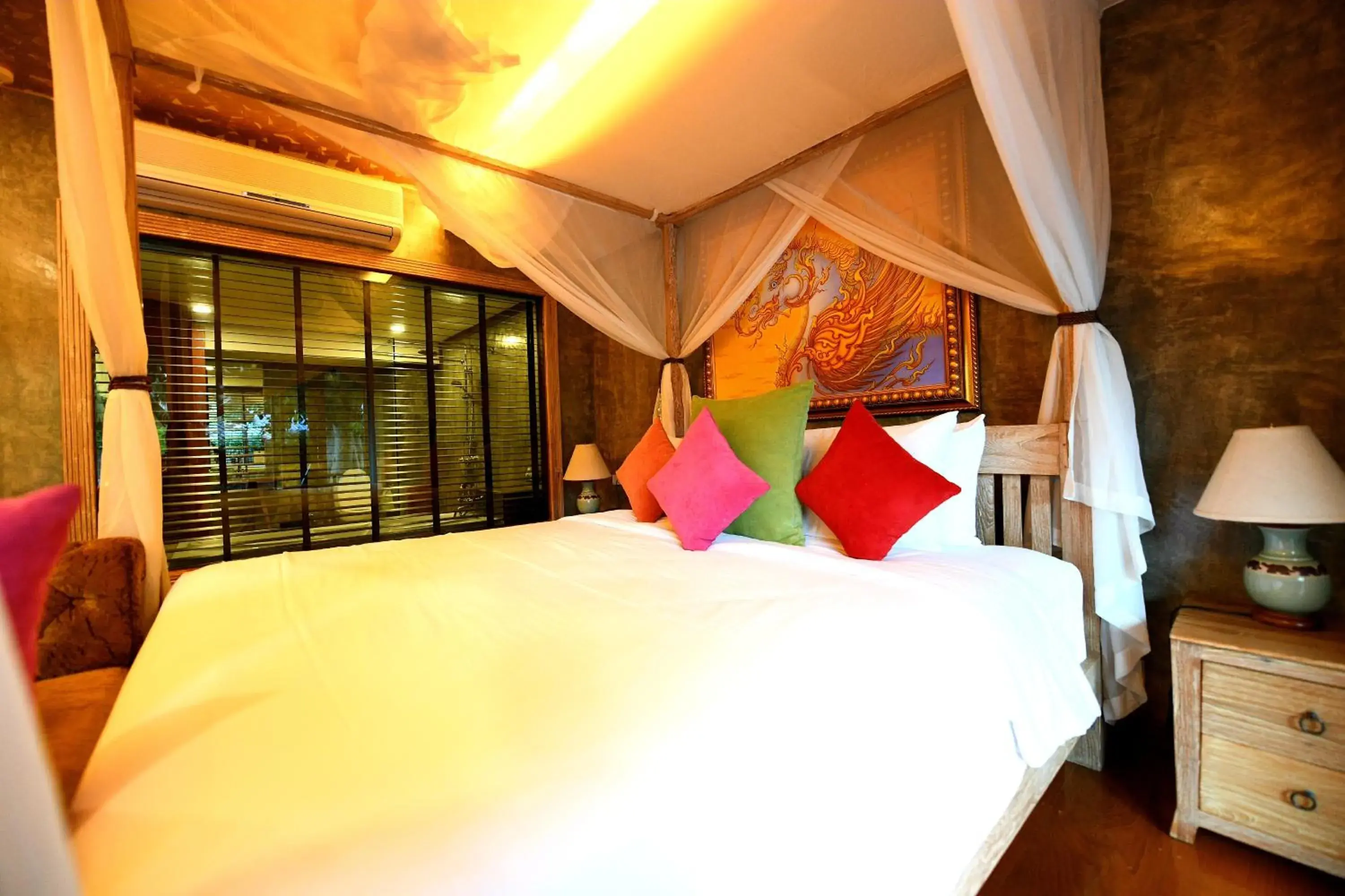 Bed in The Chaya Resort and Spa