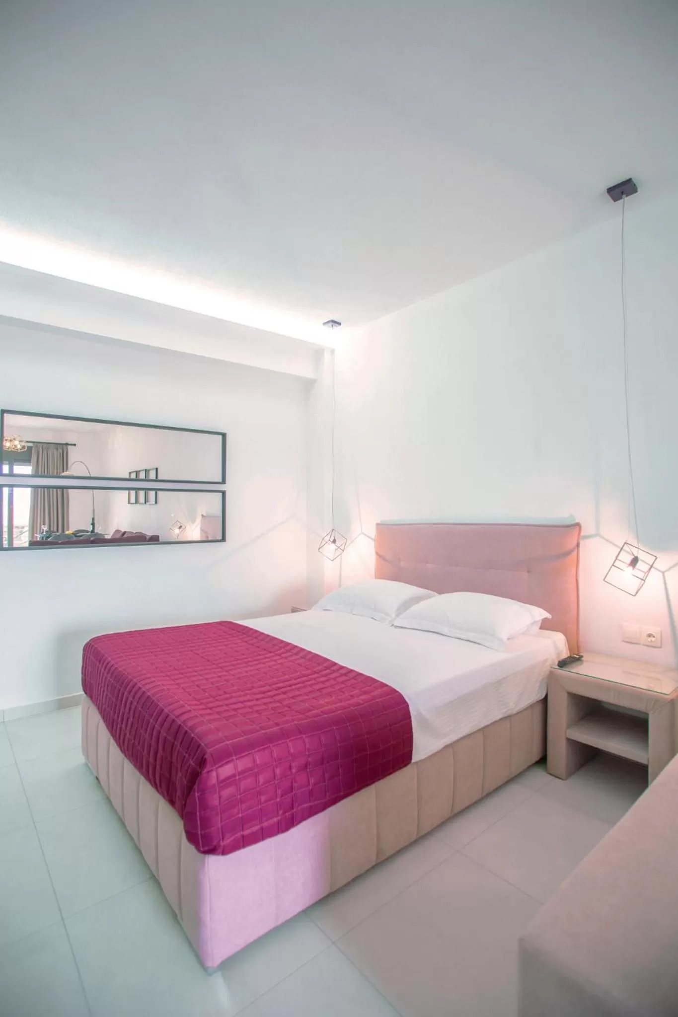 Bed in Anemos Luxury Apartments