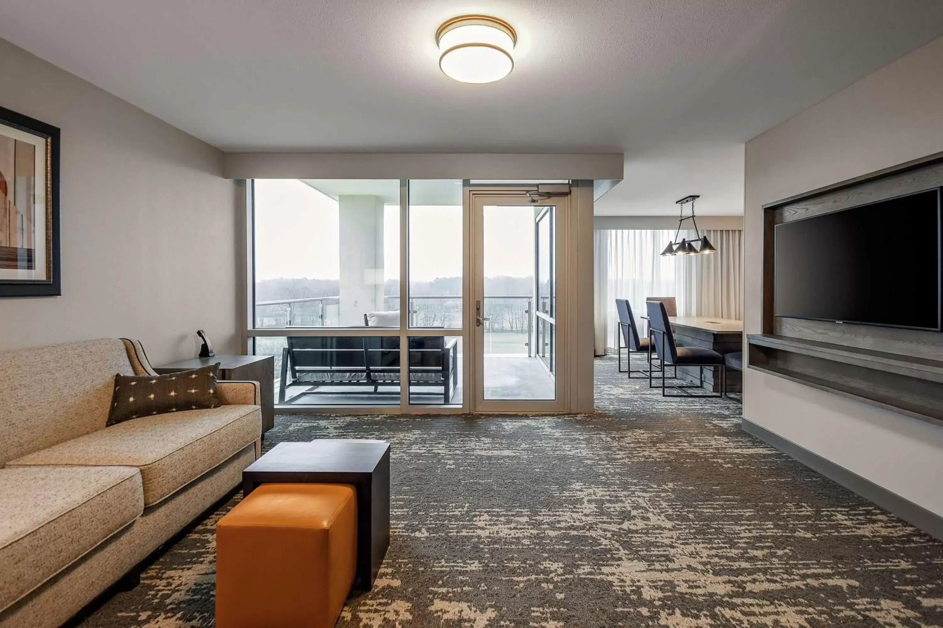 Living room in Embassy Suites by Hilton Jonesboro Red Wolf Convention Center Living room in Embassy Suites by Hilton Jonesboro Red Wolf Convention Center