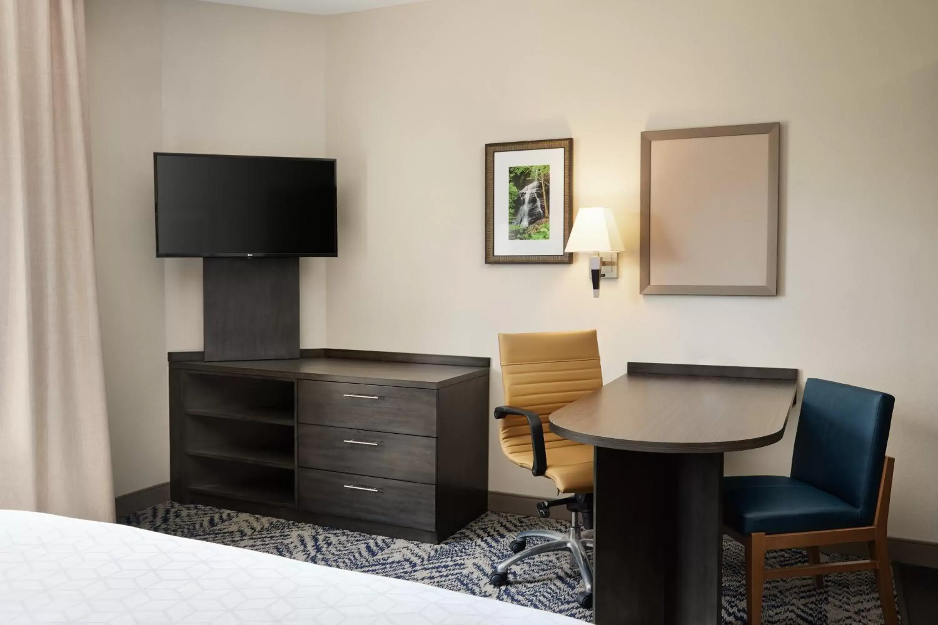 Photo of the whole room, TV/Entertainment Center in Candlewood Suites I-26 @ Northwoods Mall, an IHG Hotel