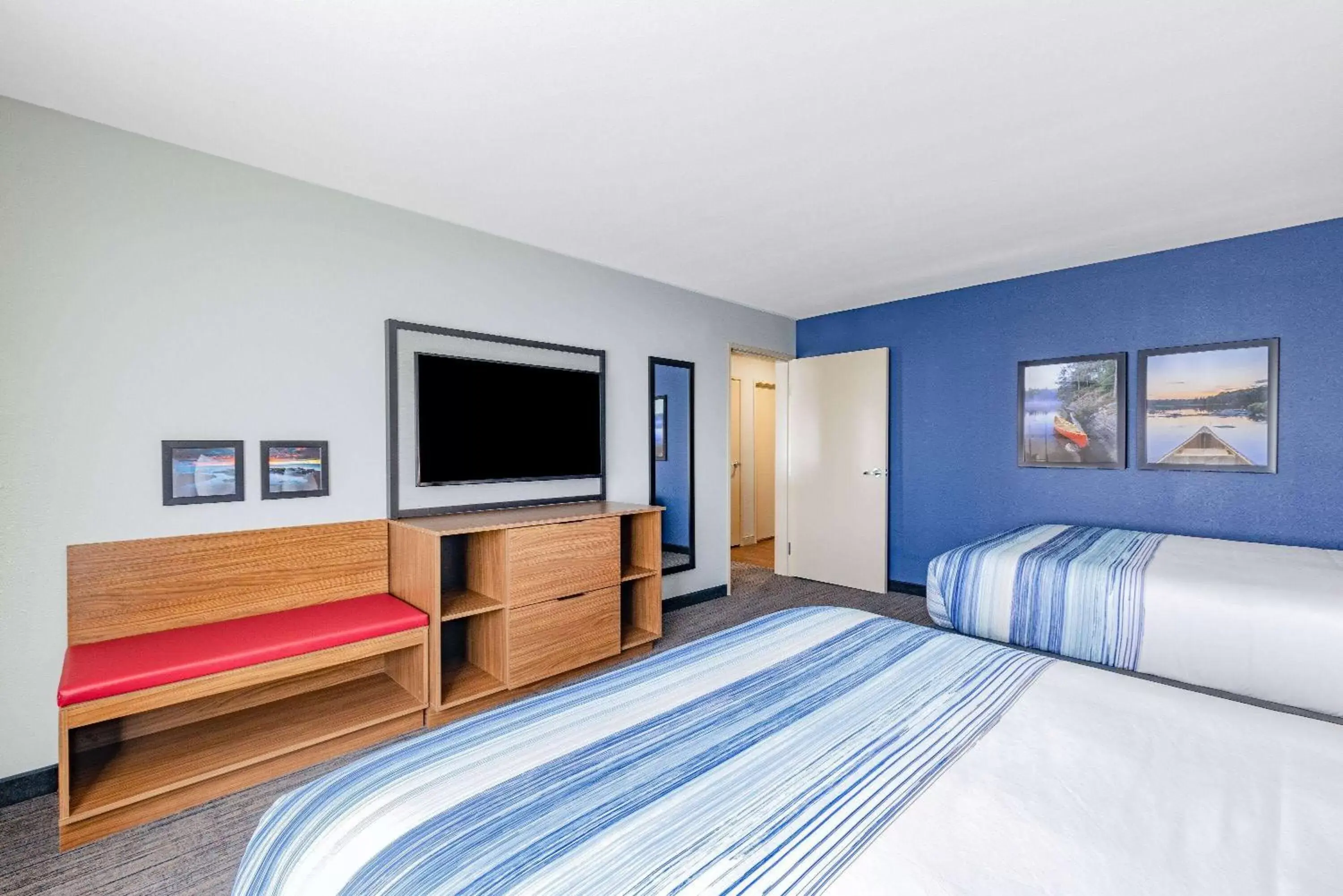 Bed in AmericInn by Wyndham International Falls