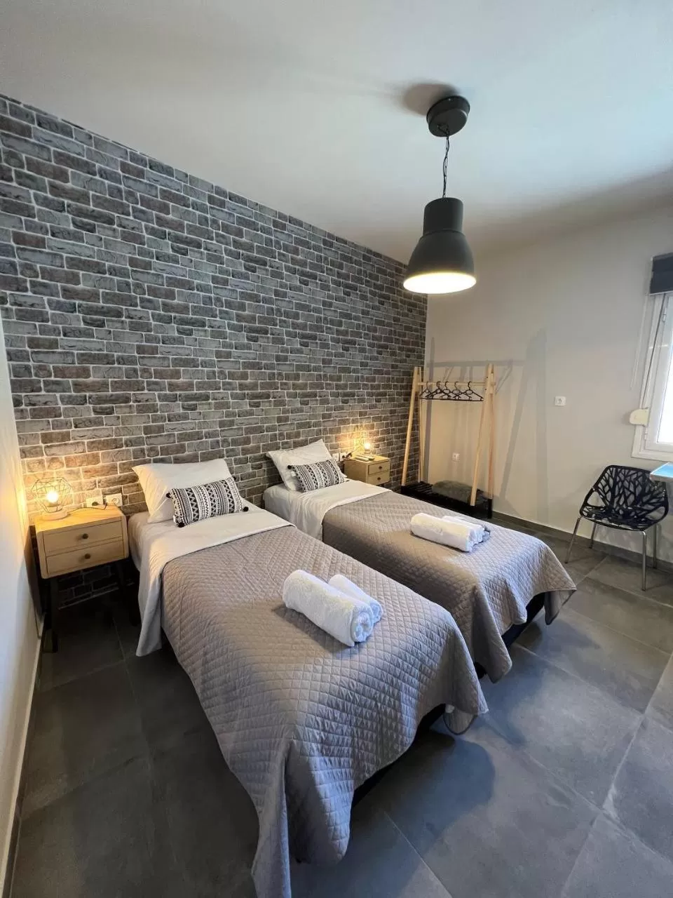 Bed in Elefsinian Mysteries Apartments