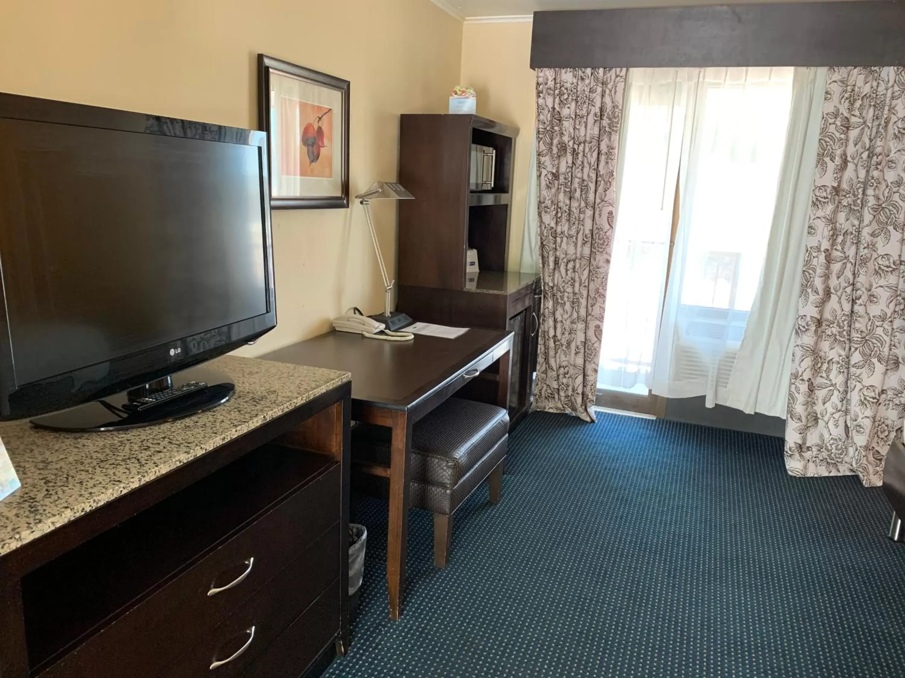 TV and multimedia, TV/Entertainment Center in Travelodge by Wyndham Rapid City