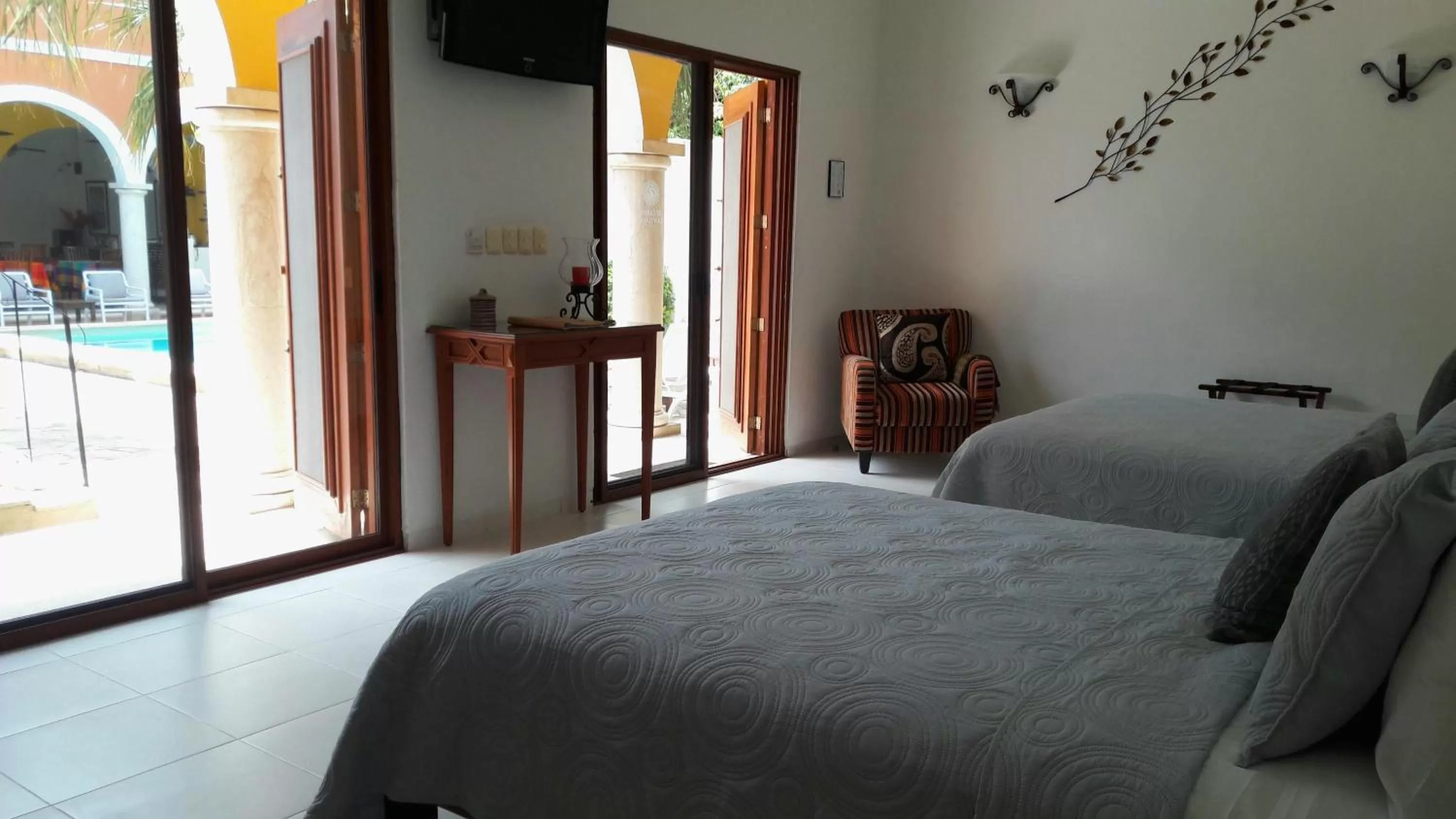 Suite with Spa Bath and Pool View in Merida Santiago Hotel Boutique