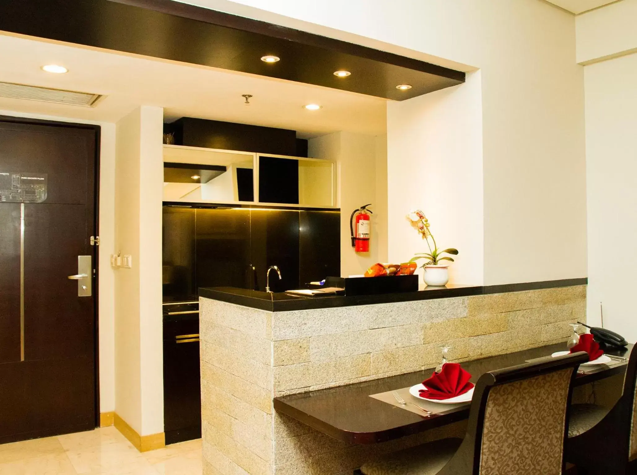 Kitchen or kitchenette, Lobby/Reception in Grandkemang Hotel